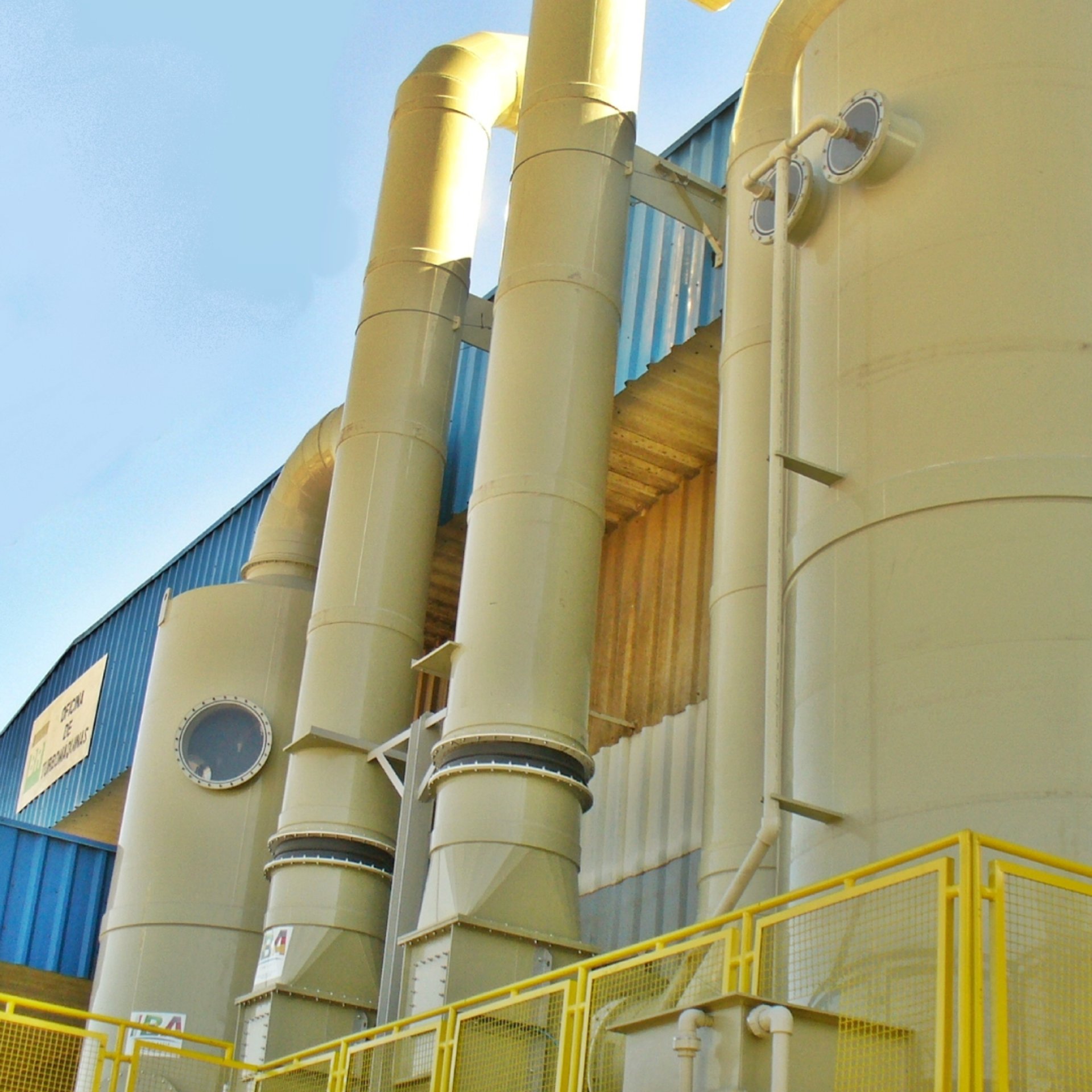 an abstract photo of a curved building with a blue sky in the background