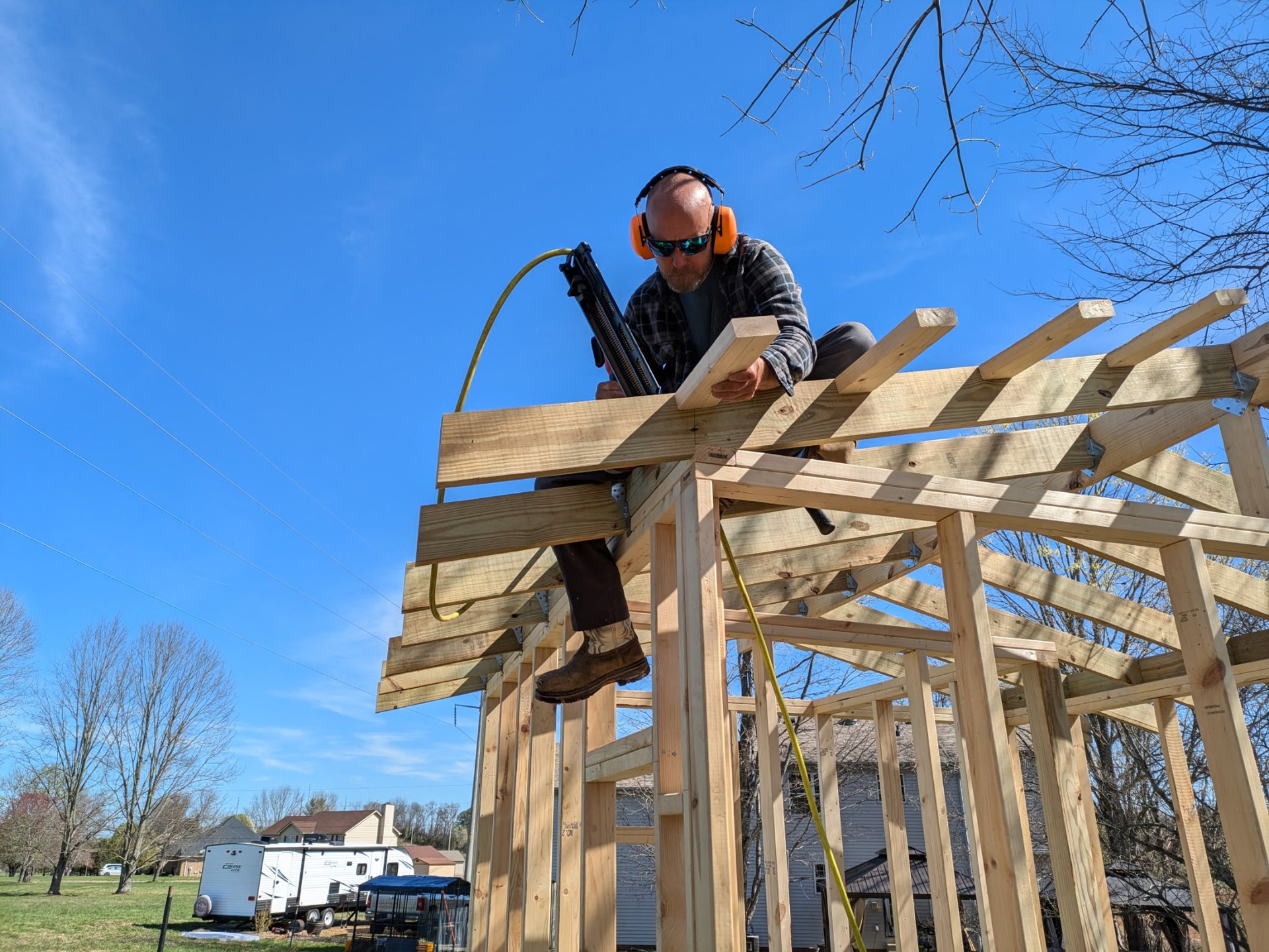 woman wearing yellow long-sleeved dress under white clouds and blue sky during daytime