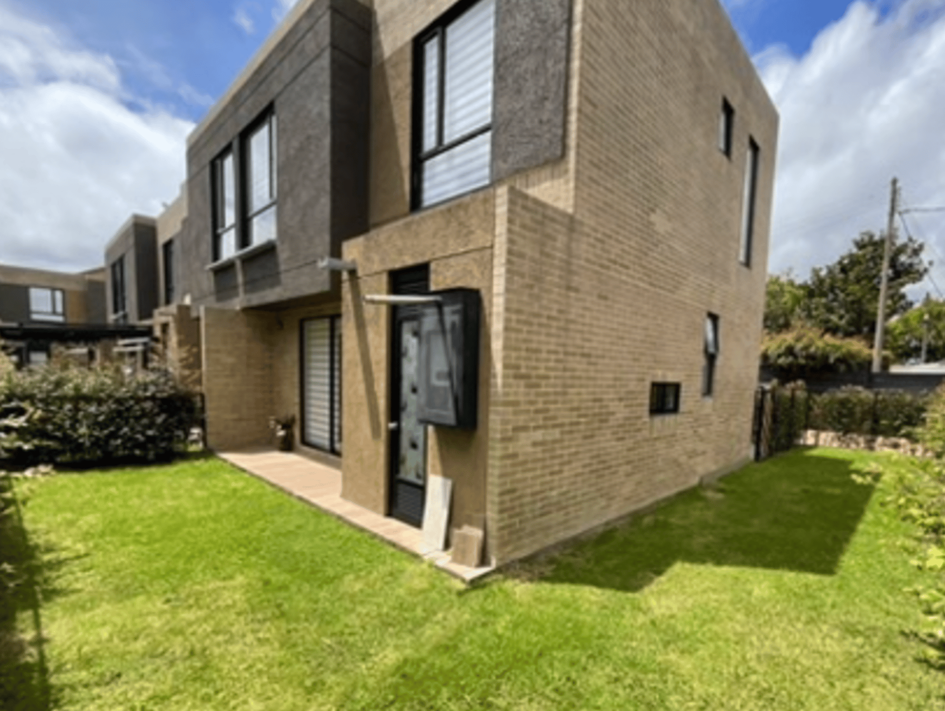black and brown leather padded tub sofa