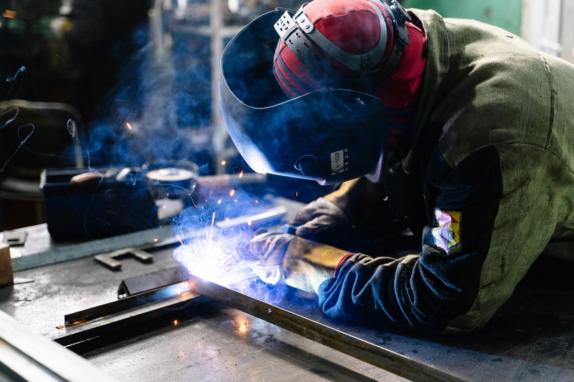a welder working on a piece of metal