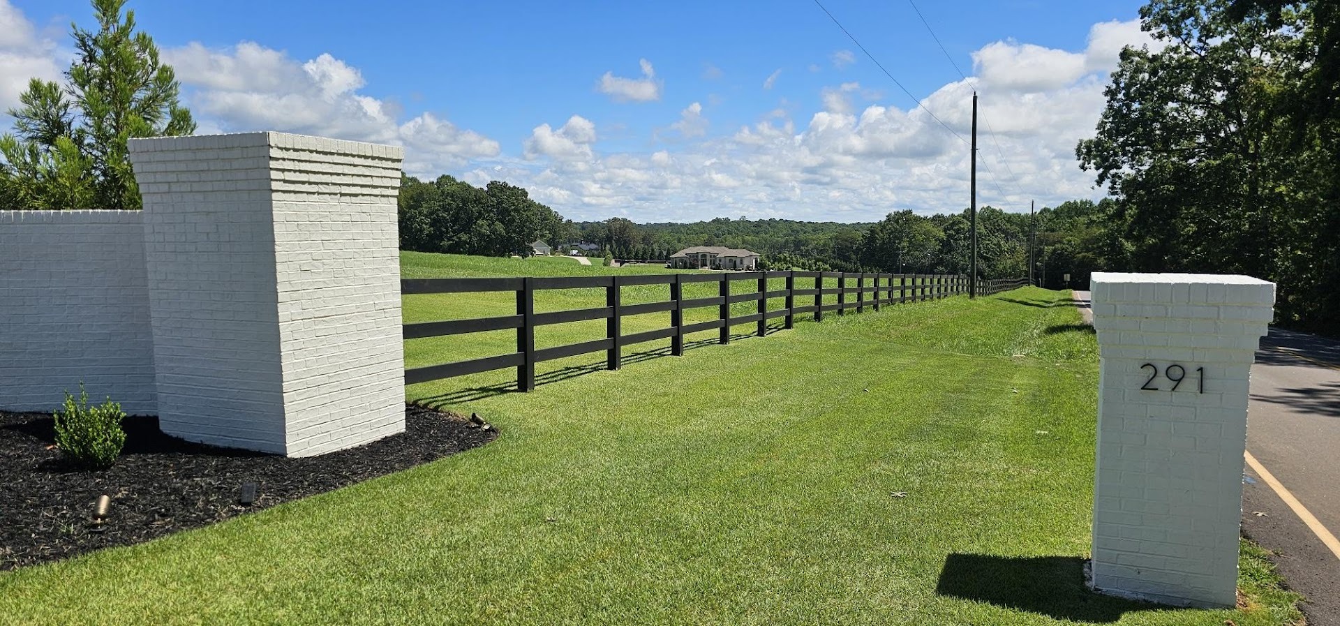 an abstract photo of a curved building with a blue sky in the background