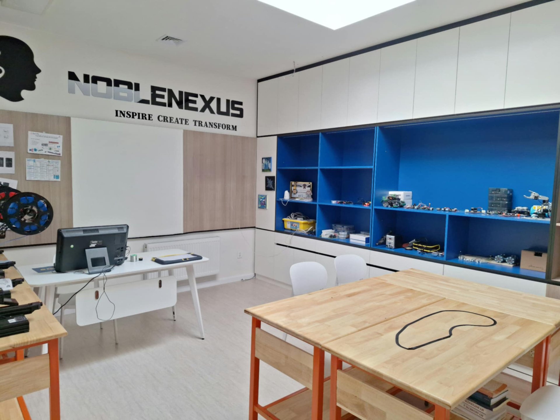 A picture of a 3D printer with wires coming out of it