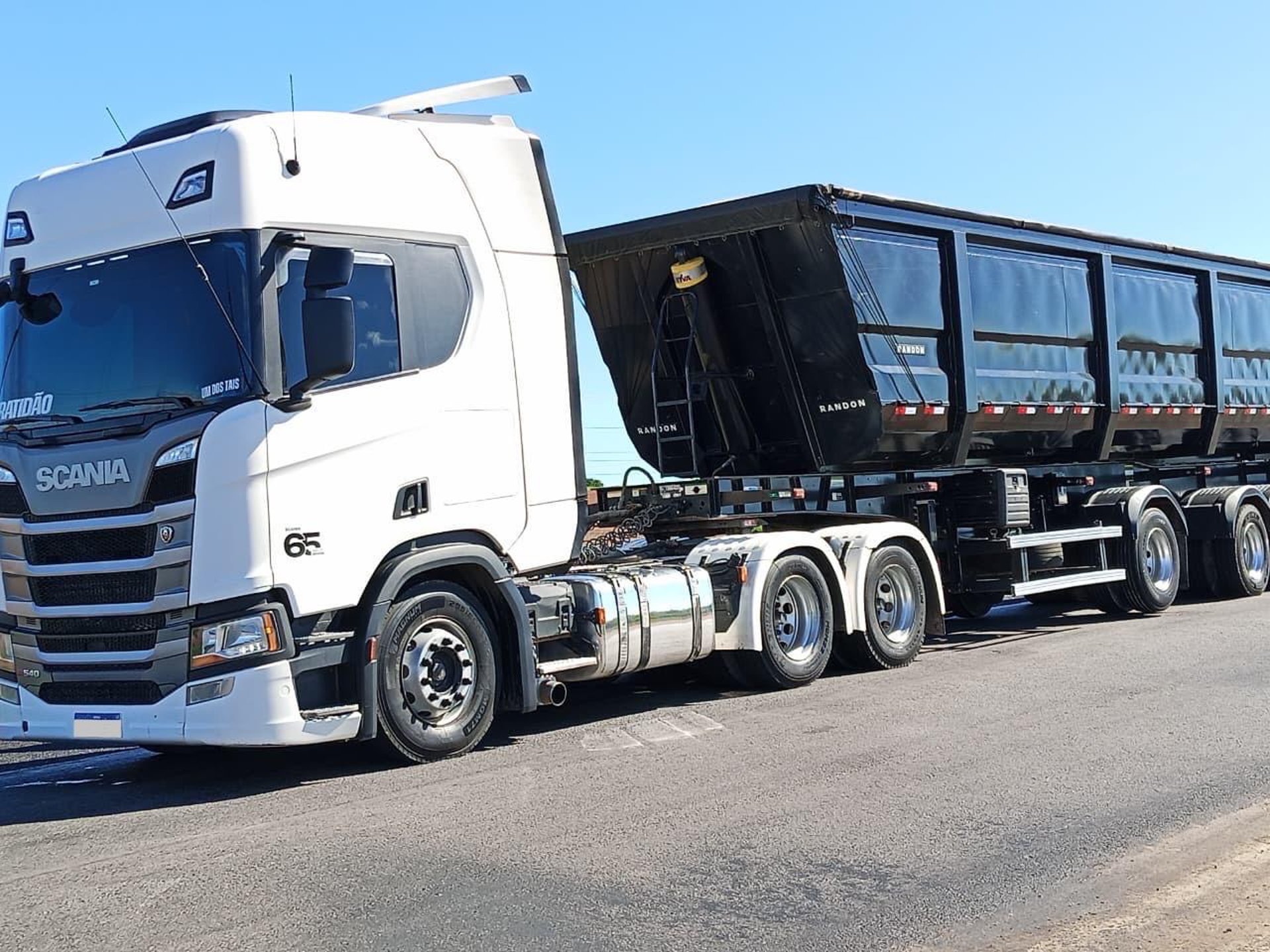 an abstract photo of a curved building with a blue sky in the background