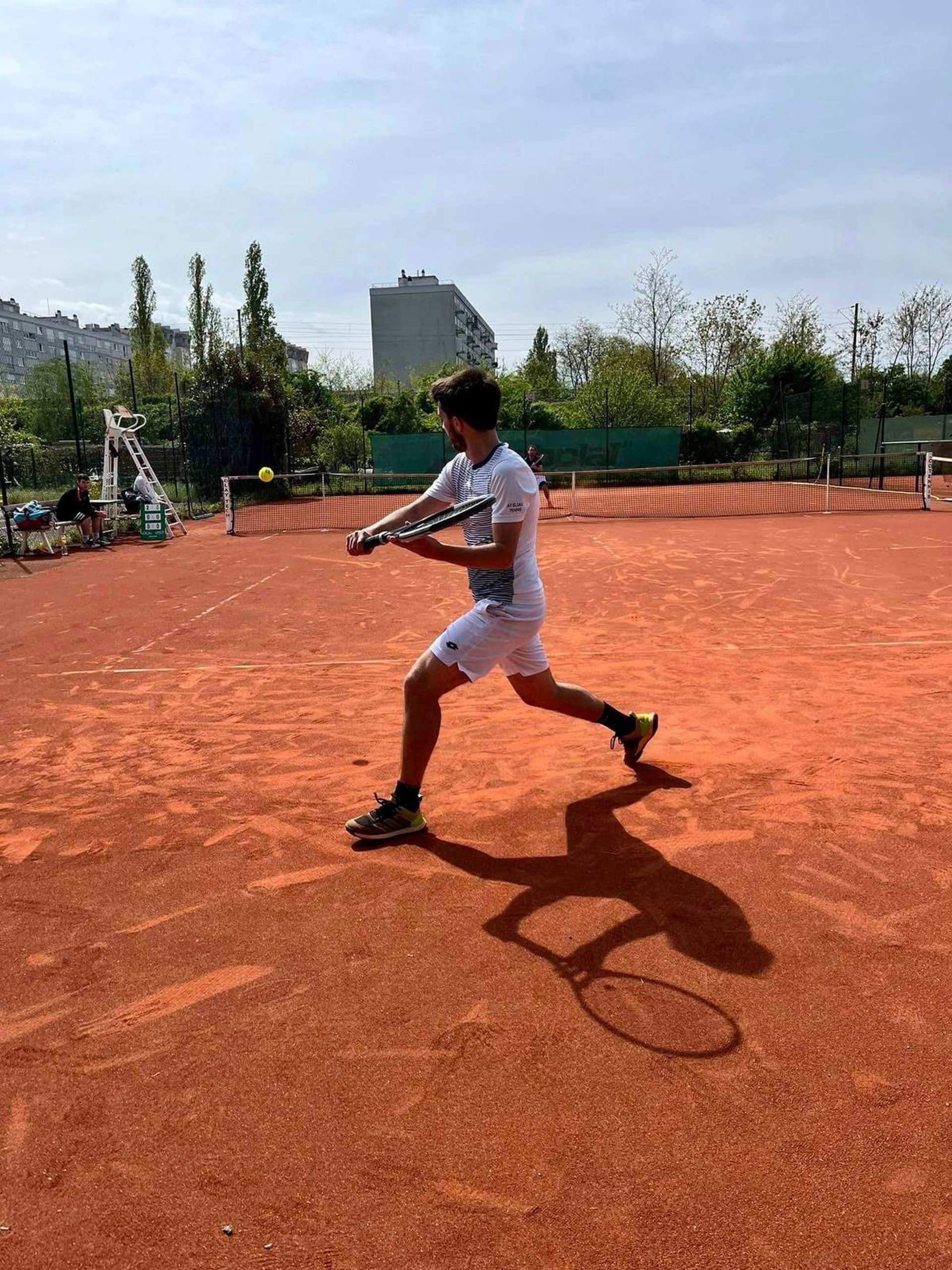 a person holding a tennis racket