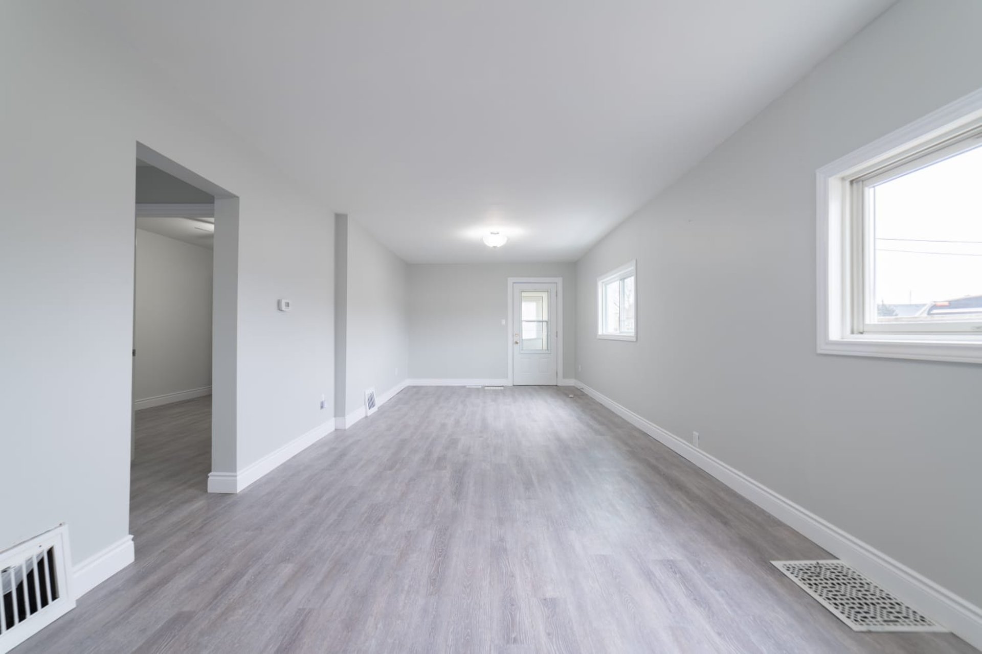 woman wearing yellow long-sleeved dress under white clouds and blue sky during daytime