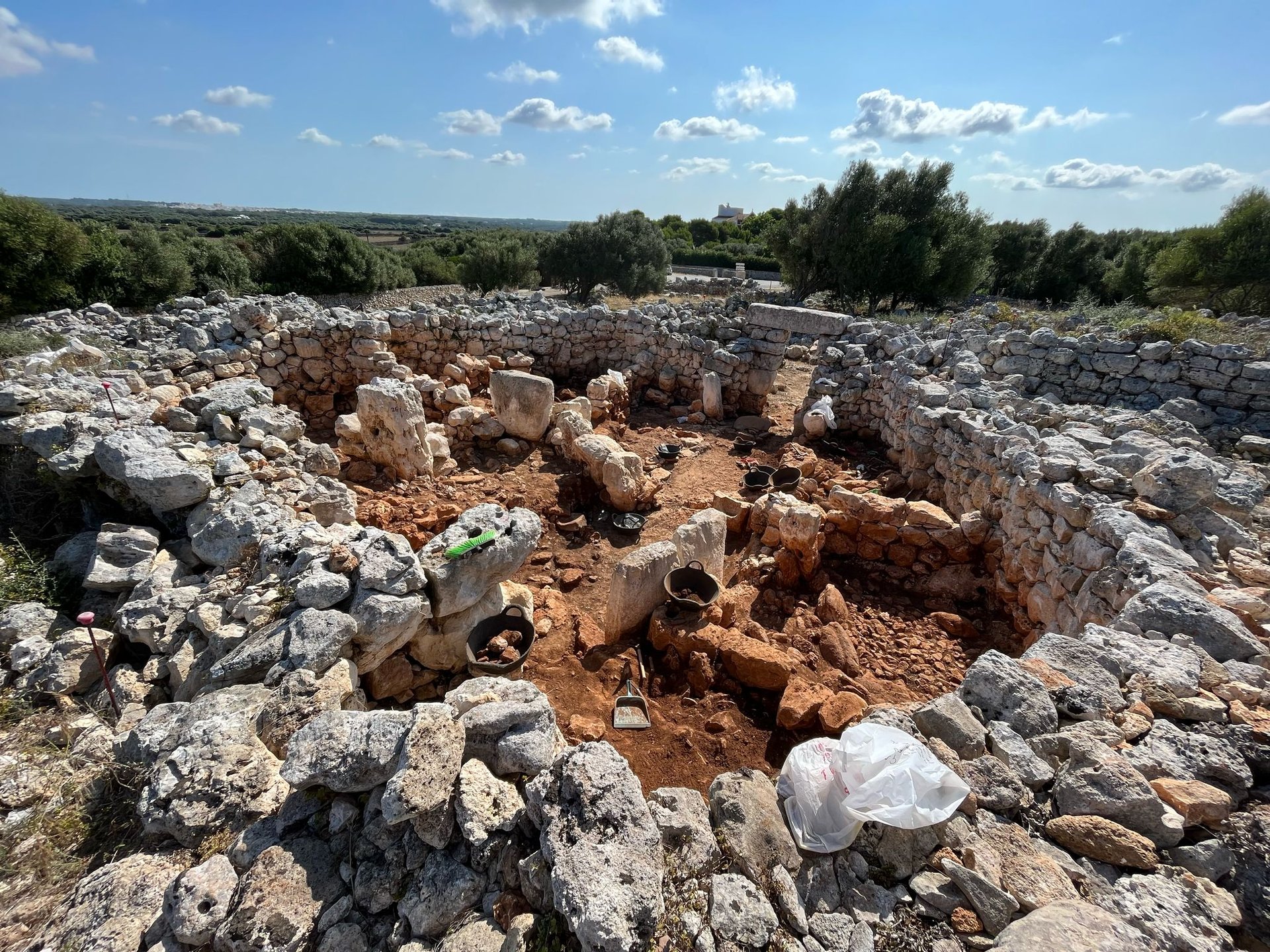 woman wearing yellow long-sleeved dress under white clouds and blue sky during daytime