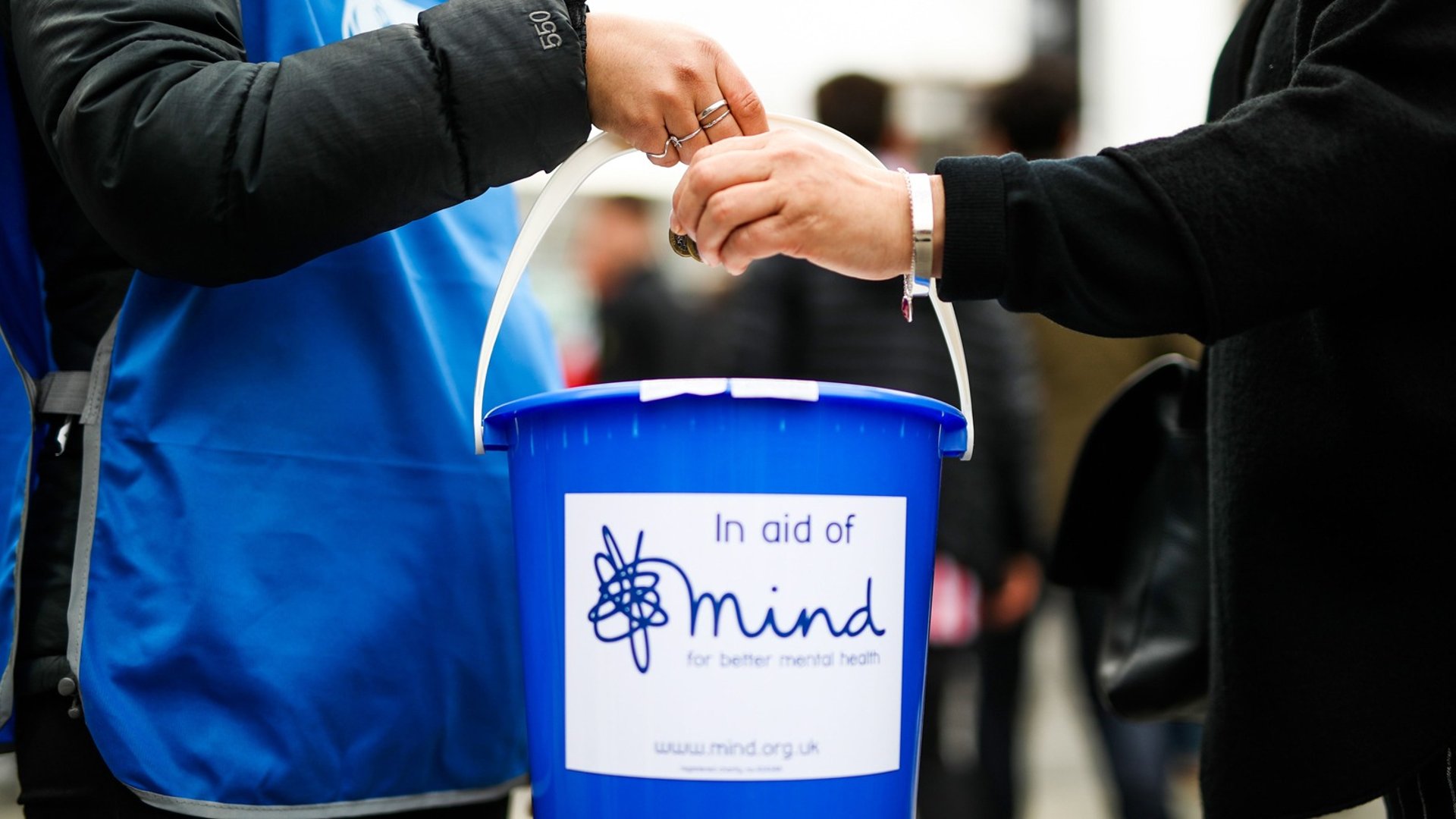 an abstract photo of a curved building with a blue sky in the background