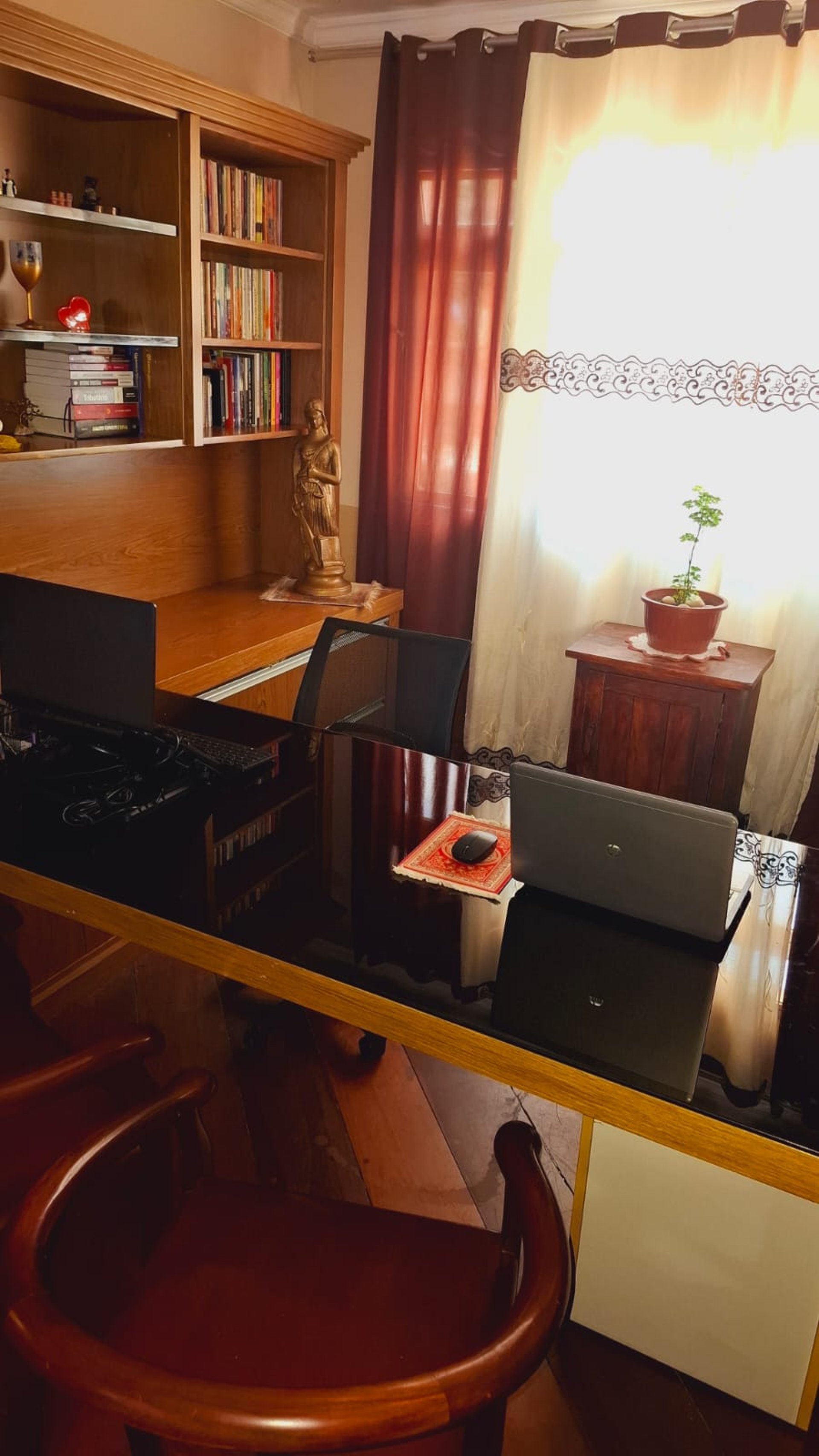 an abstract photo of a curved building with a blue sky in the background