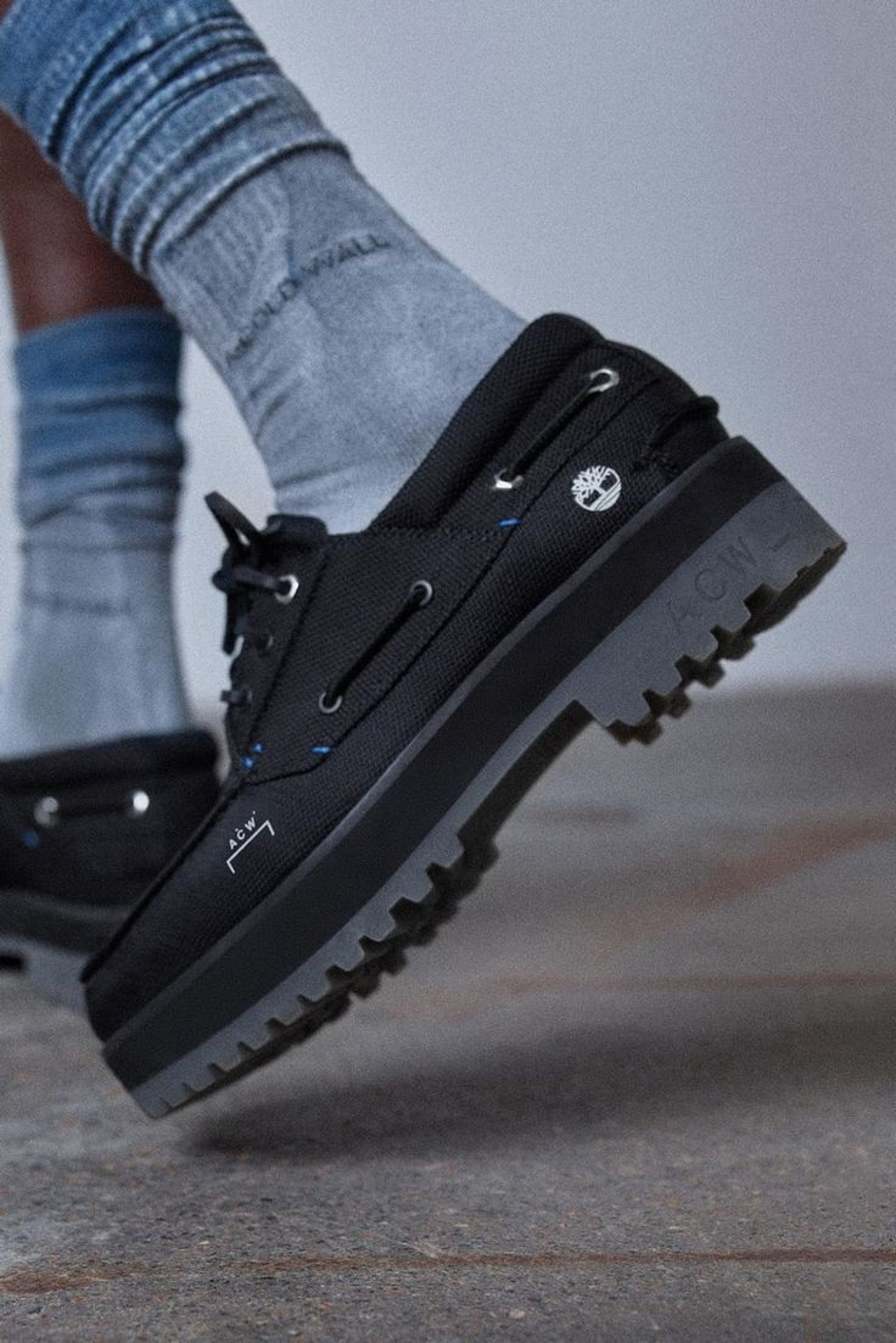 an abstract photo of a curved building with a blue sky in the background