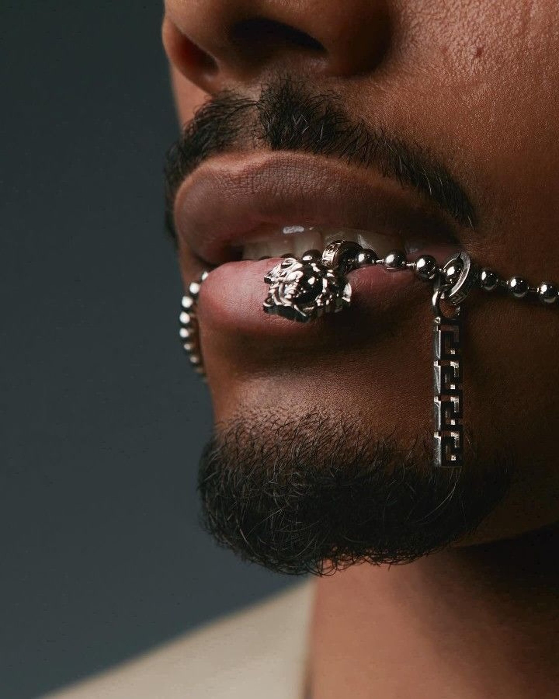 an abstract photo of a curved building with a blue sky in the background