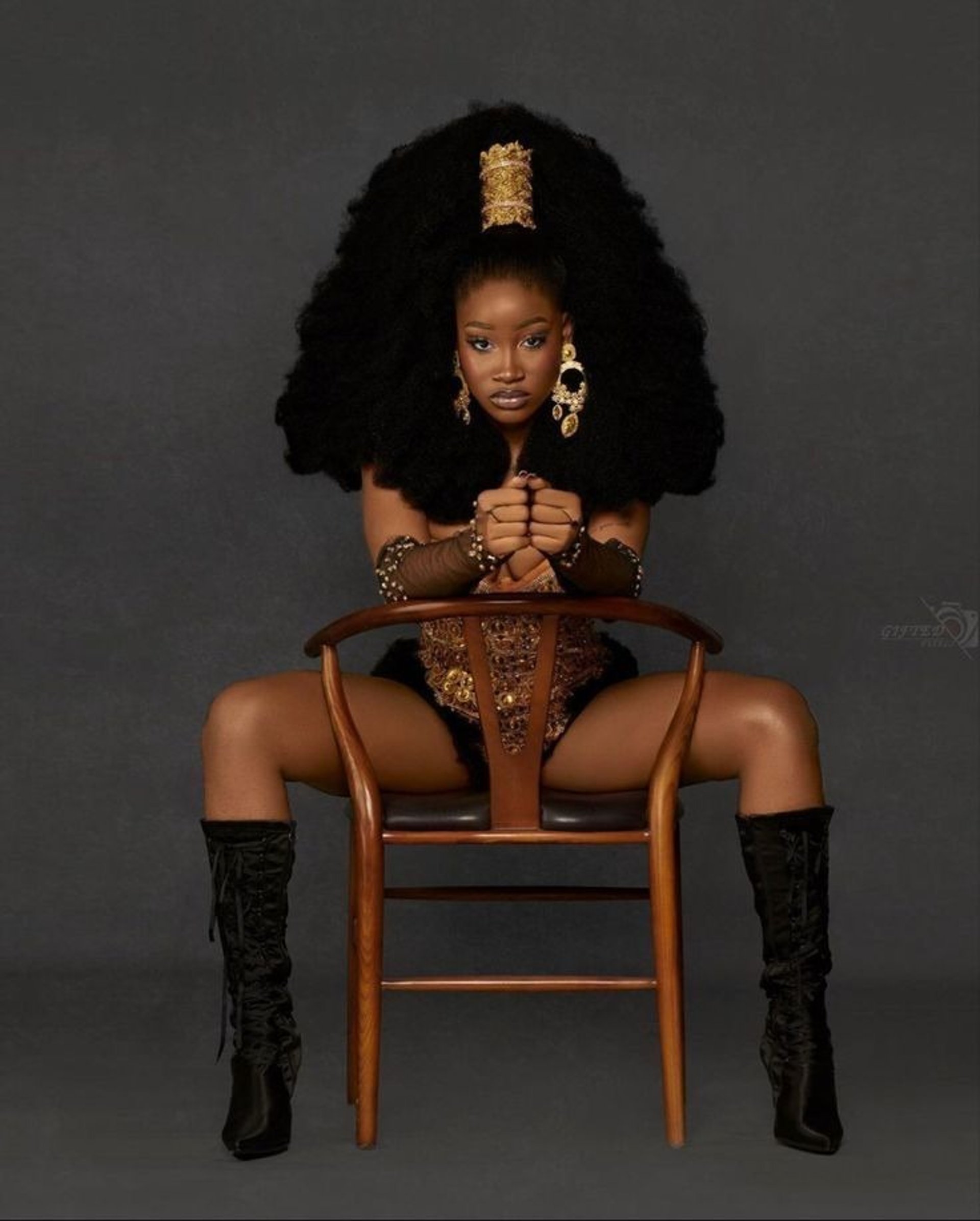 an abstract photo of a curved building with a blue sky in the background