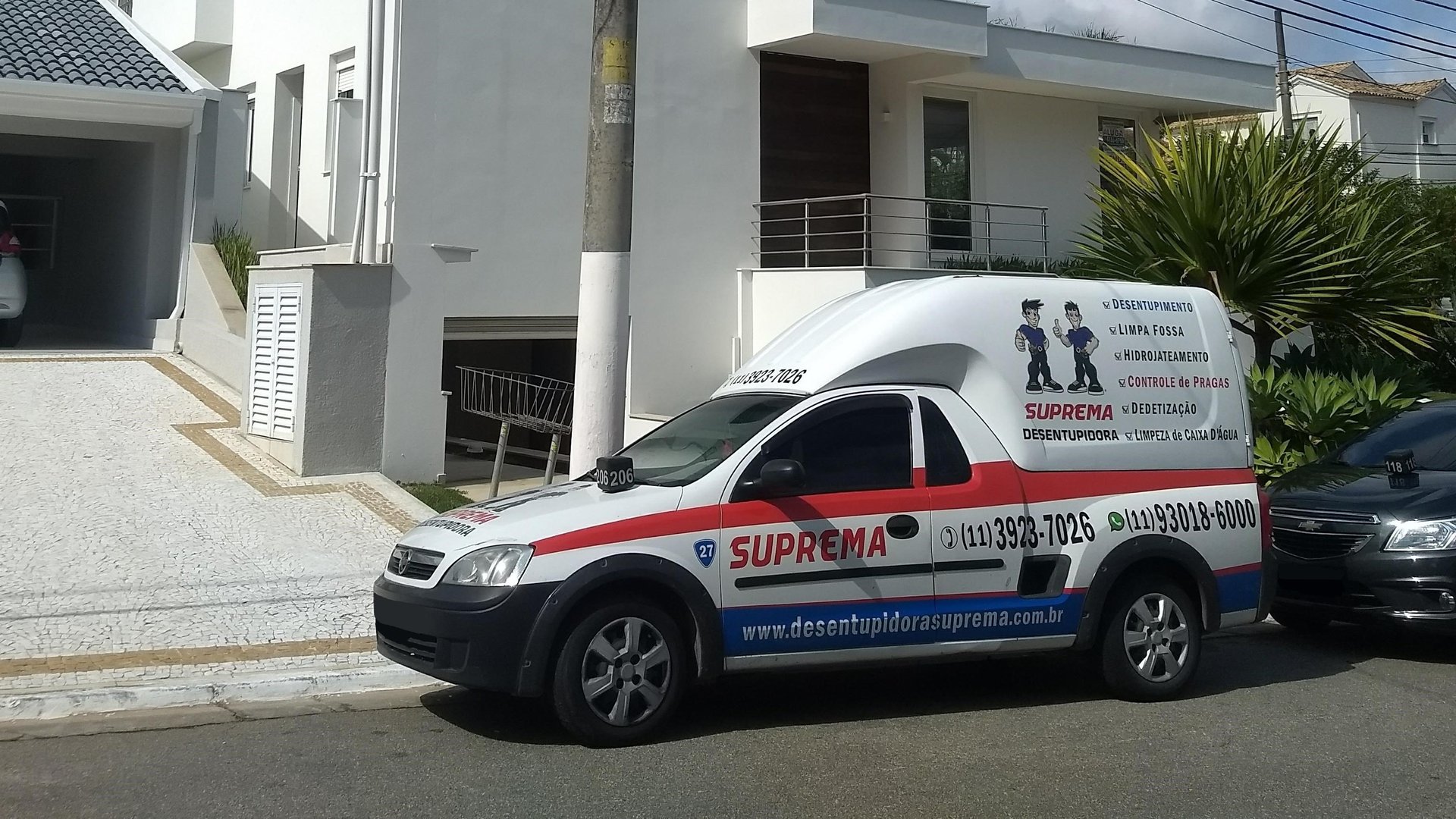 an abstract photo of a curved building with a blue sky in the background