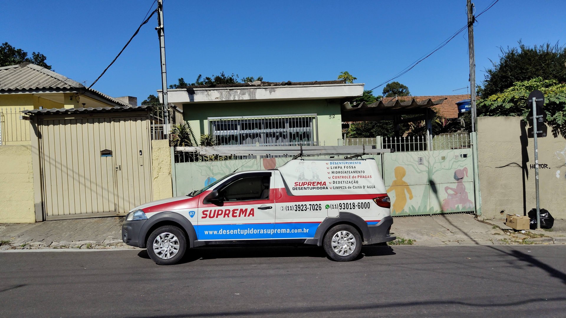 an abstract photo of a curved building with a blue sky in the background