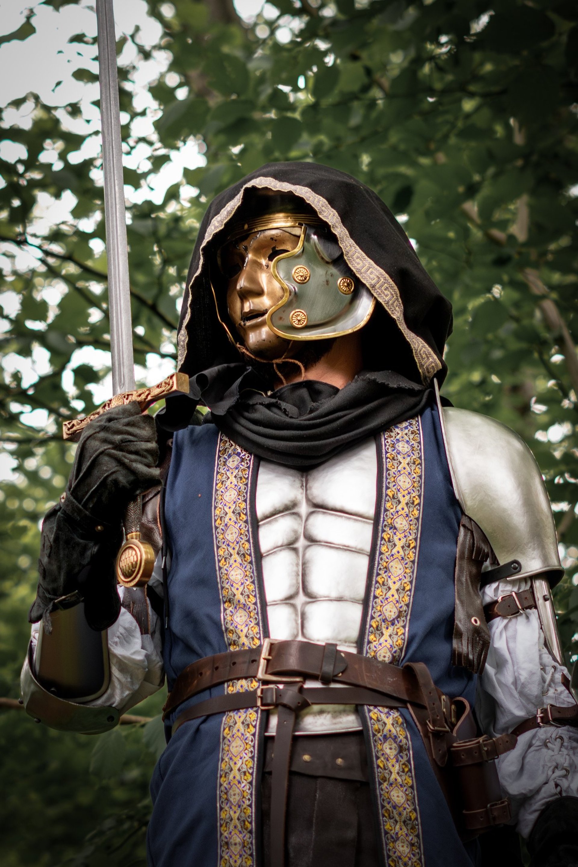 an abstract photo of a curved building with a blue sky in the background