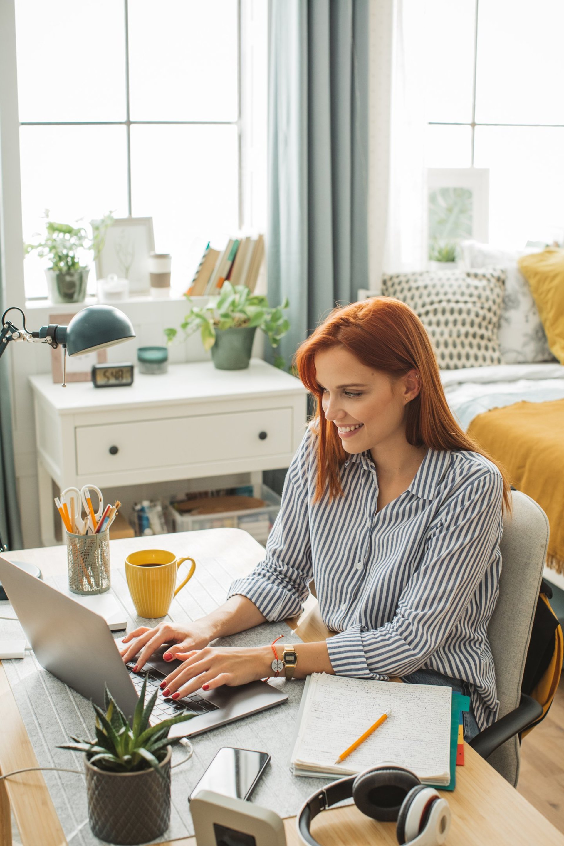 woman in black blazer using macbook