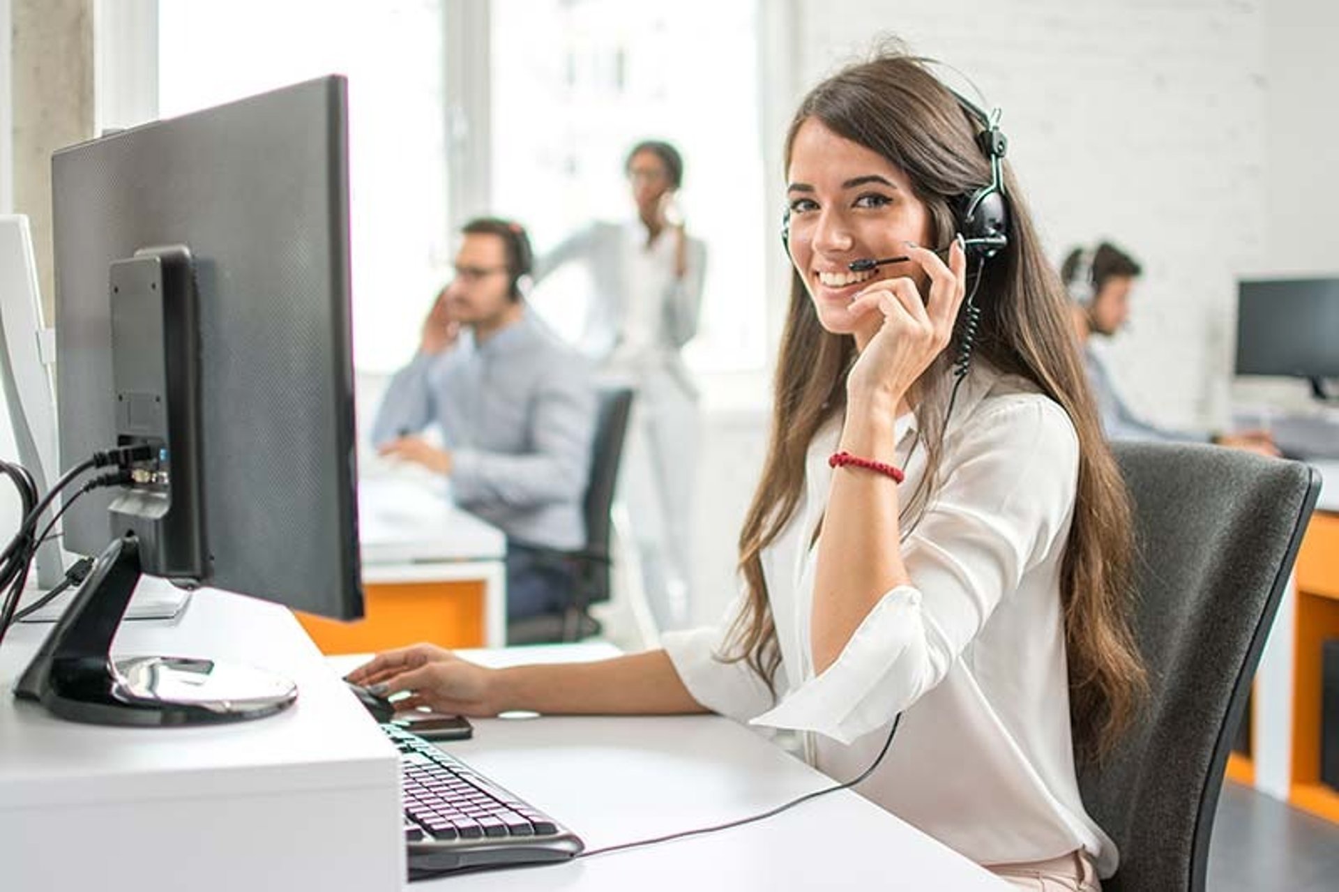 unknown persons using computer indoors
