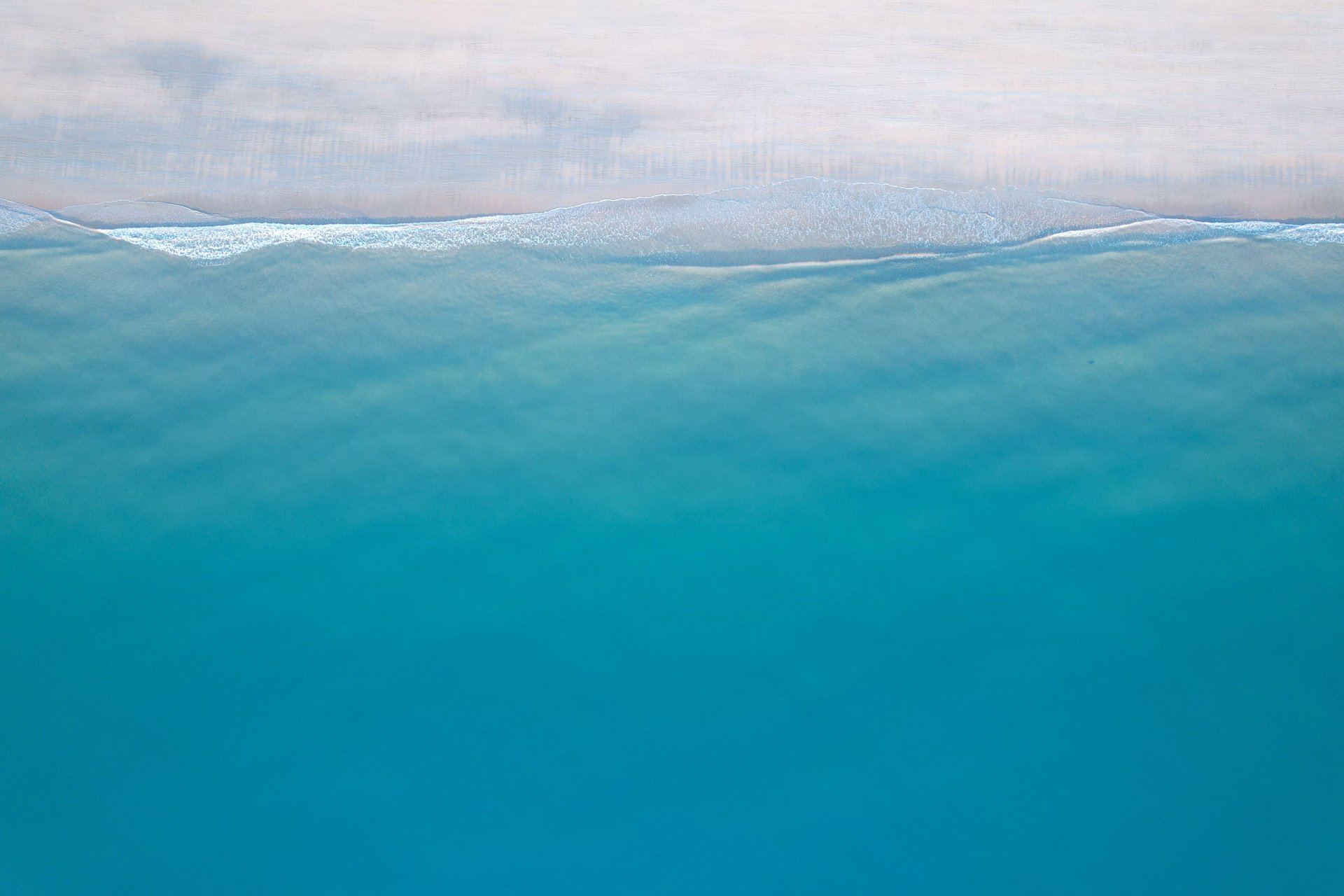 a close up of a white wall with wavy lines