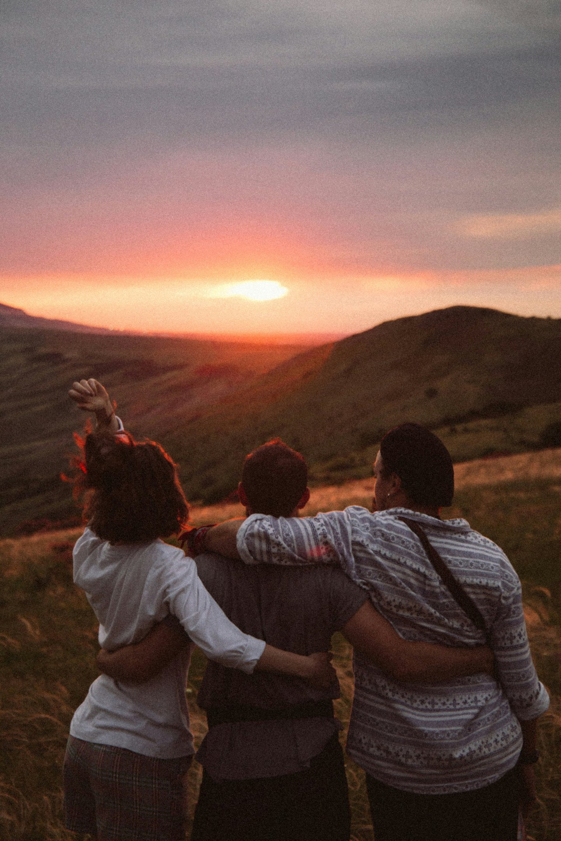 silhouette of people standing on highland during golden hours