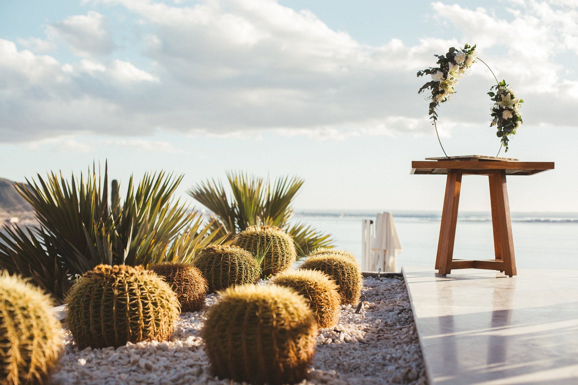 A moment captured by Los Cabos Wedding Films at the Garza Blanca Hotel in San José del Cabo: Bridesmaids raising their floral