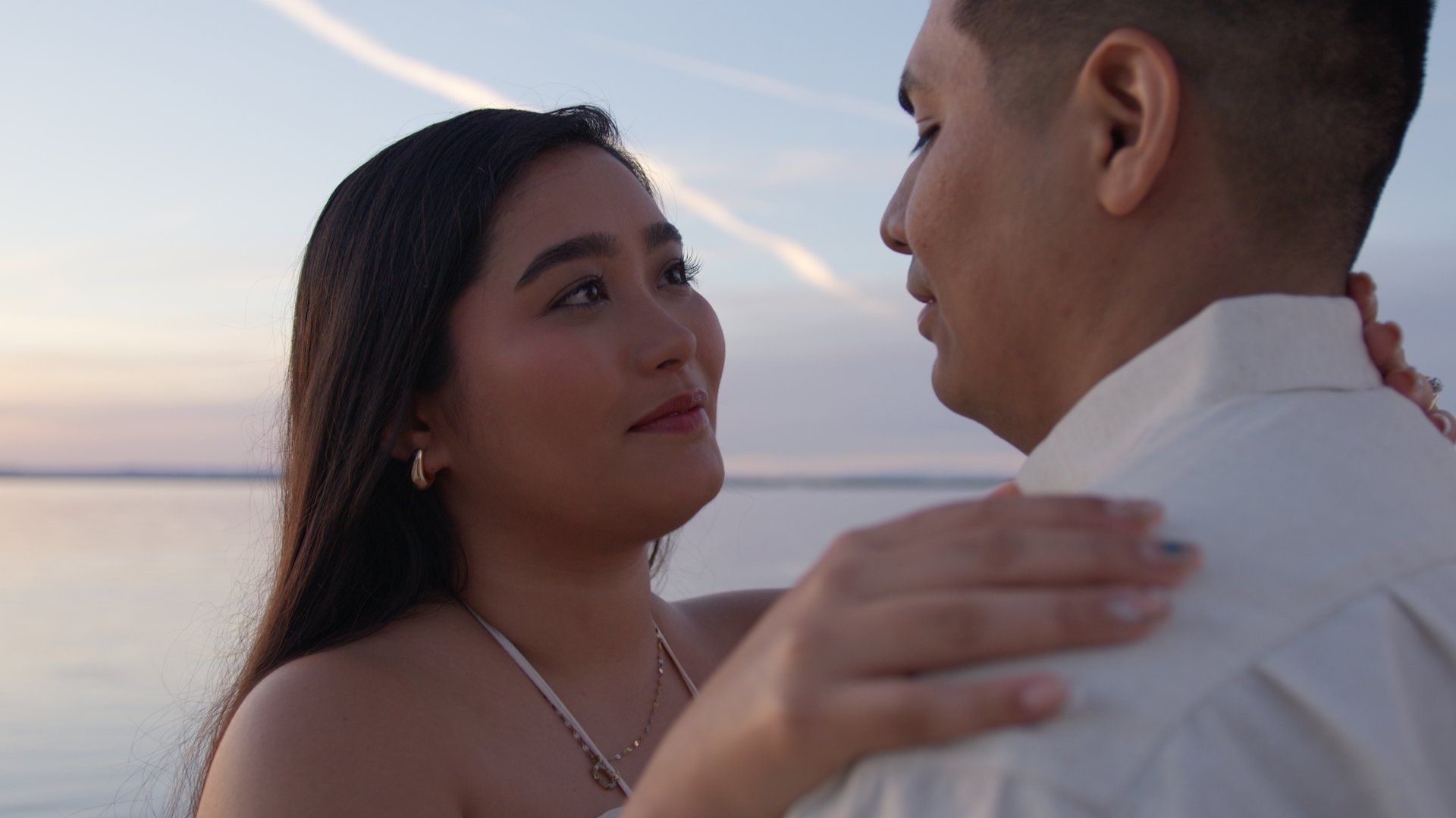 A moment captured by Los Cabos Wedding Films at the Garza Blanca Hotel in San José del Cabo: Bridesmaids raising their floral