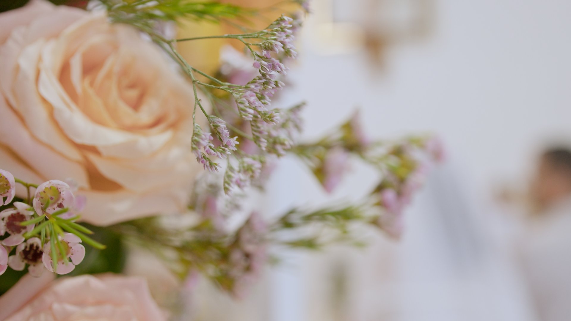 A moment captured by Los Cabos Wedding Films at the Garza Blanca Hotel in San José del Cabo: Bridesmaids raising their floral