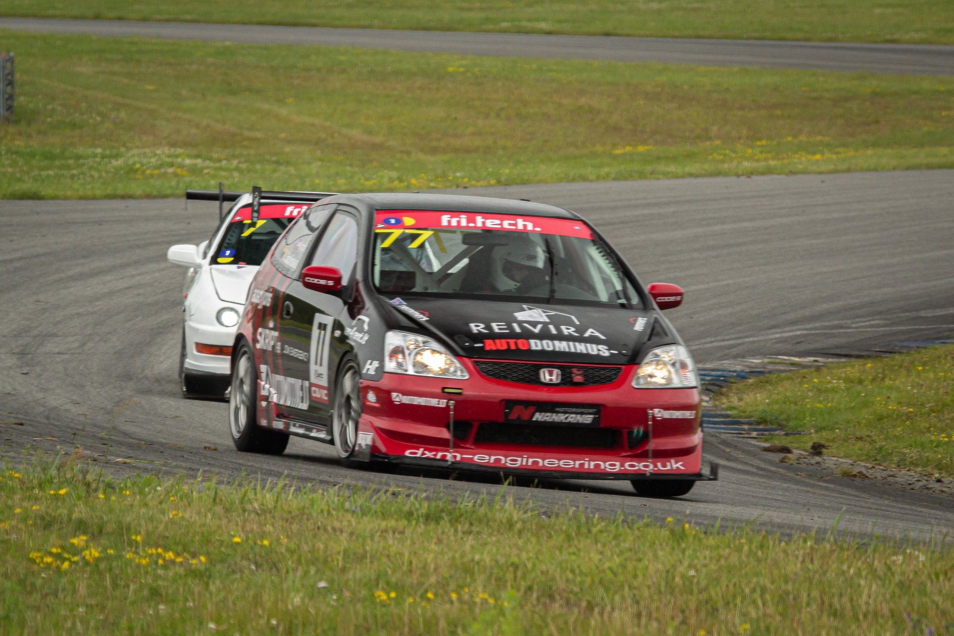 an abstract photo of a curved building with a blue sky in the background
