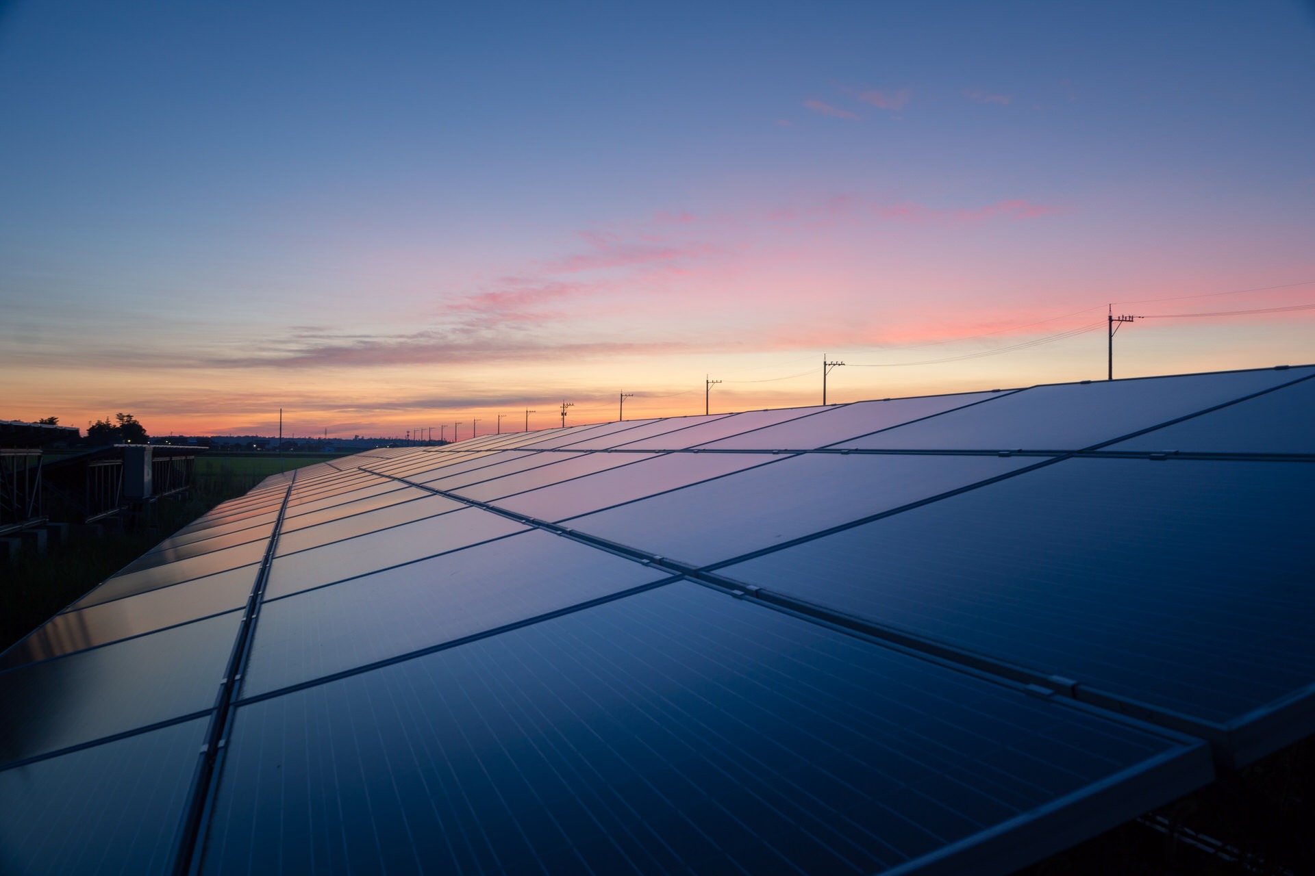 an abstract photo of a curved building with a blue sky in the background