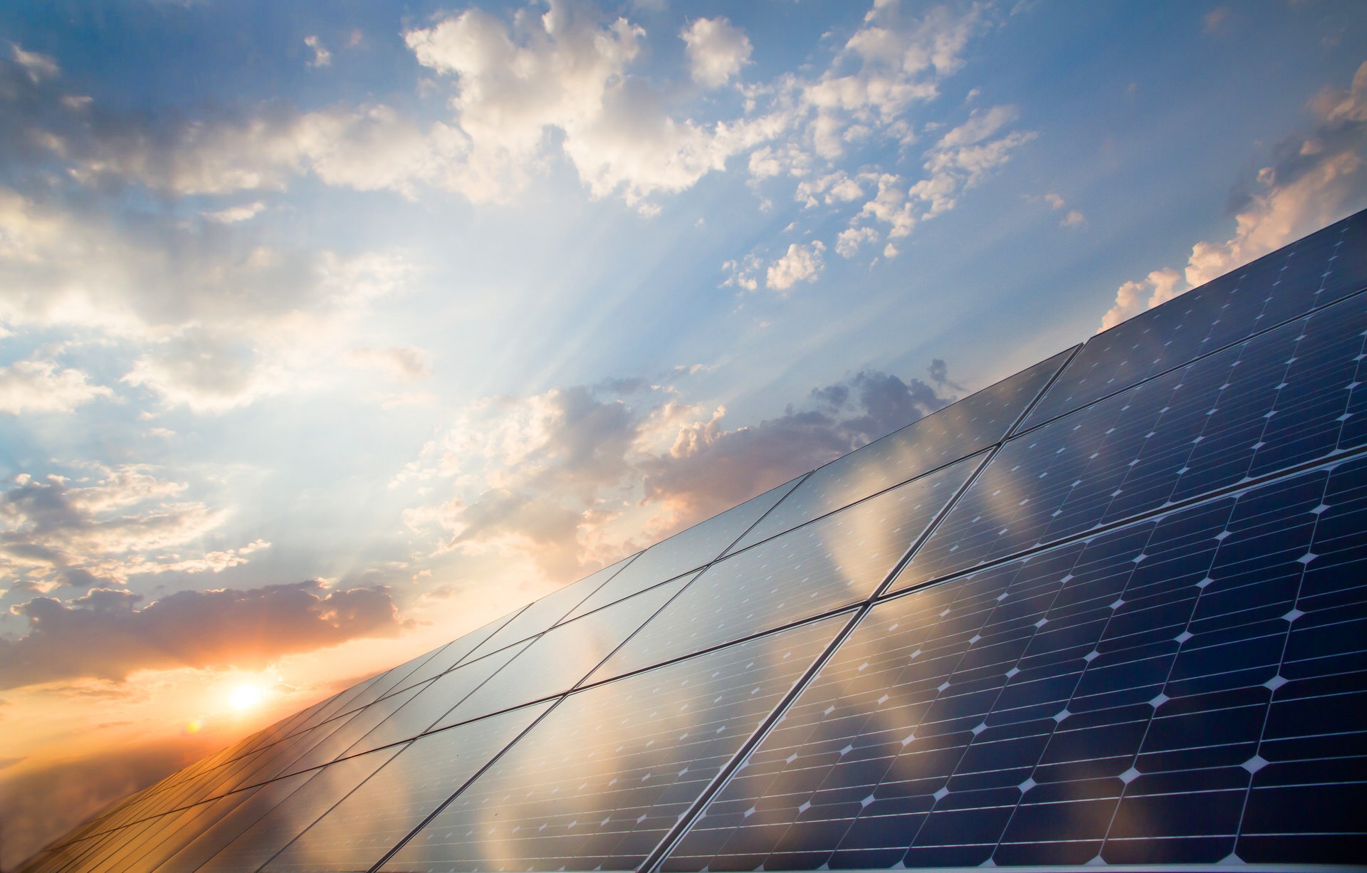 an abstract photo of a curved building with a blue sky in the background