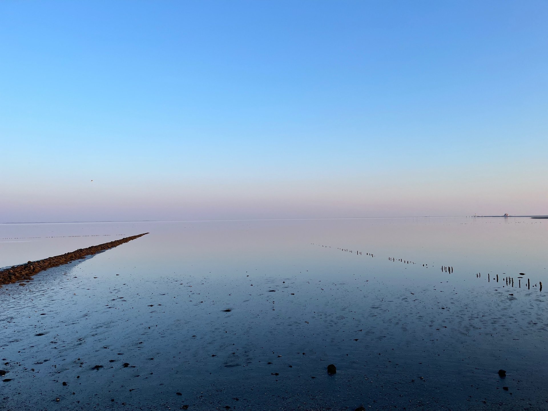 body of water under bright sky