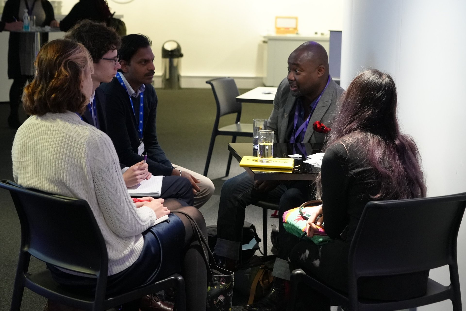 an abstract photo of a curved building with a blue sky in the background