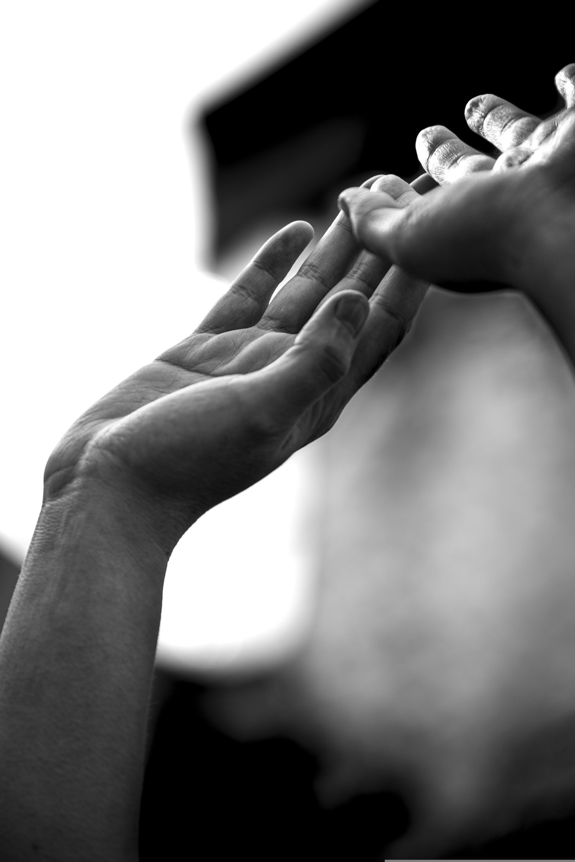 an abstract photo of a curved building with a blue sky in the background