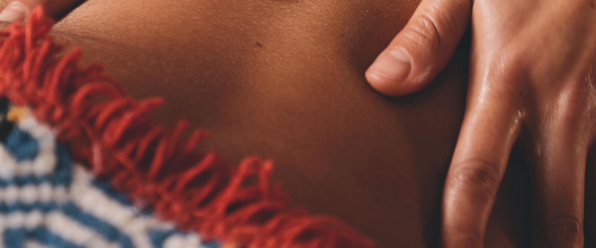 an abstract photo of a curved building with a blue sky in the background