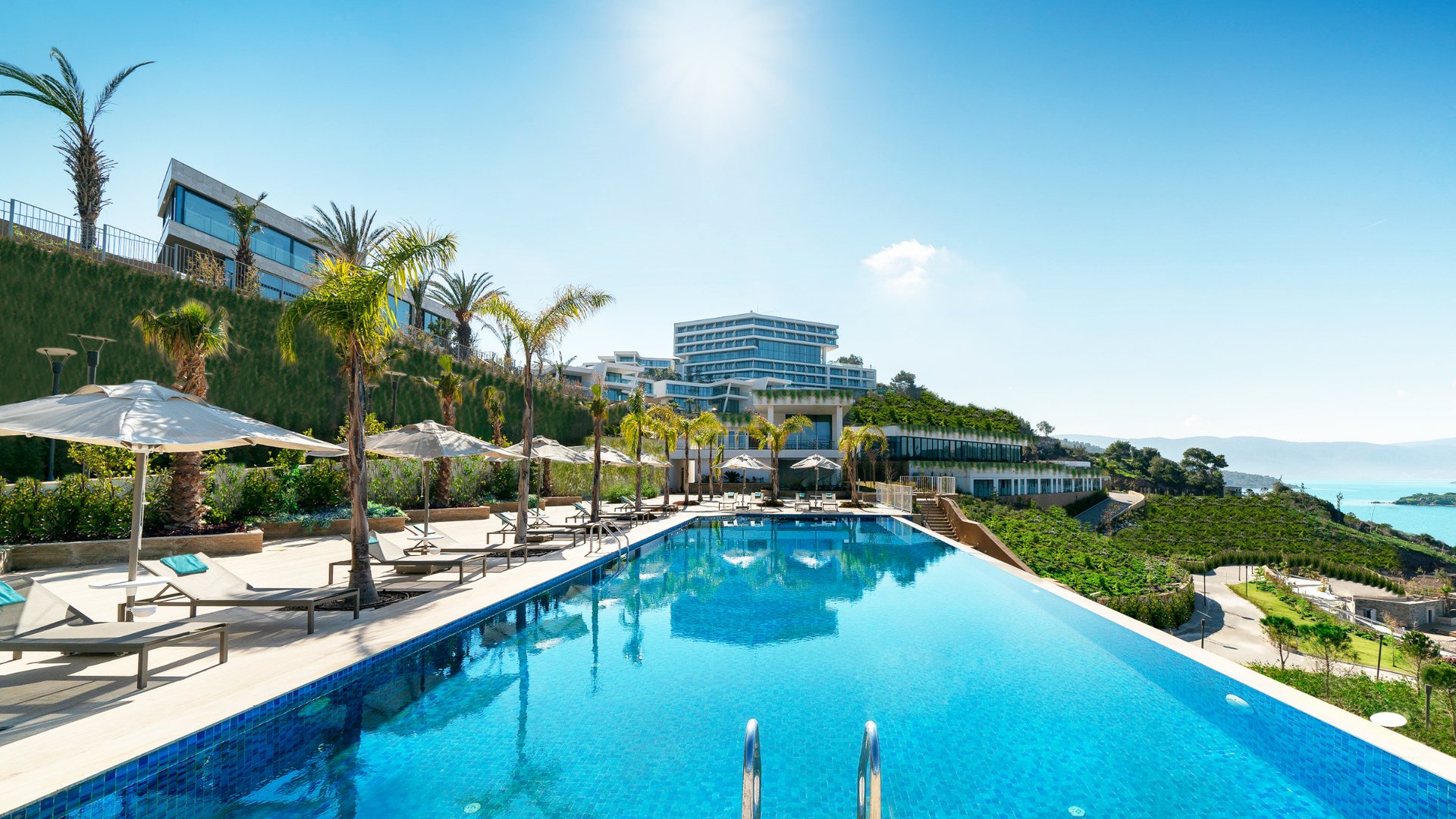 woman wearing yellow long-sleeved dress under white clouds and blue sky during daytime