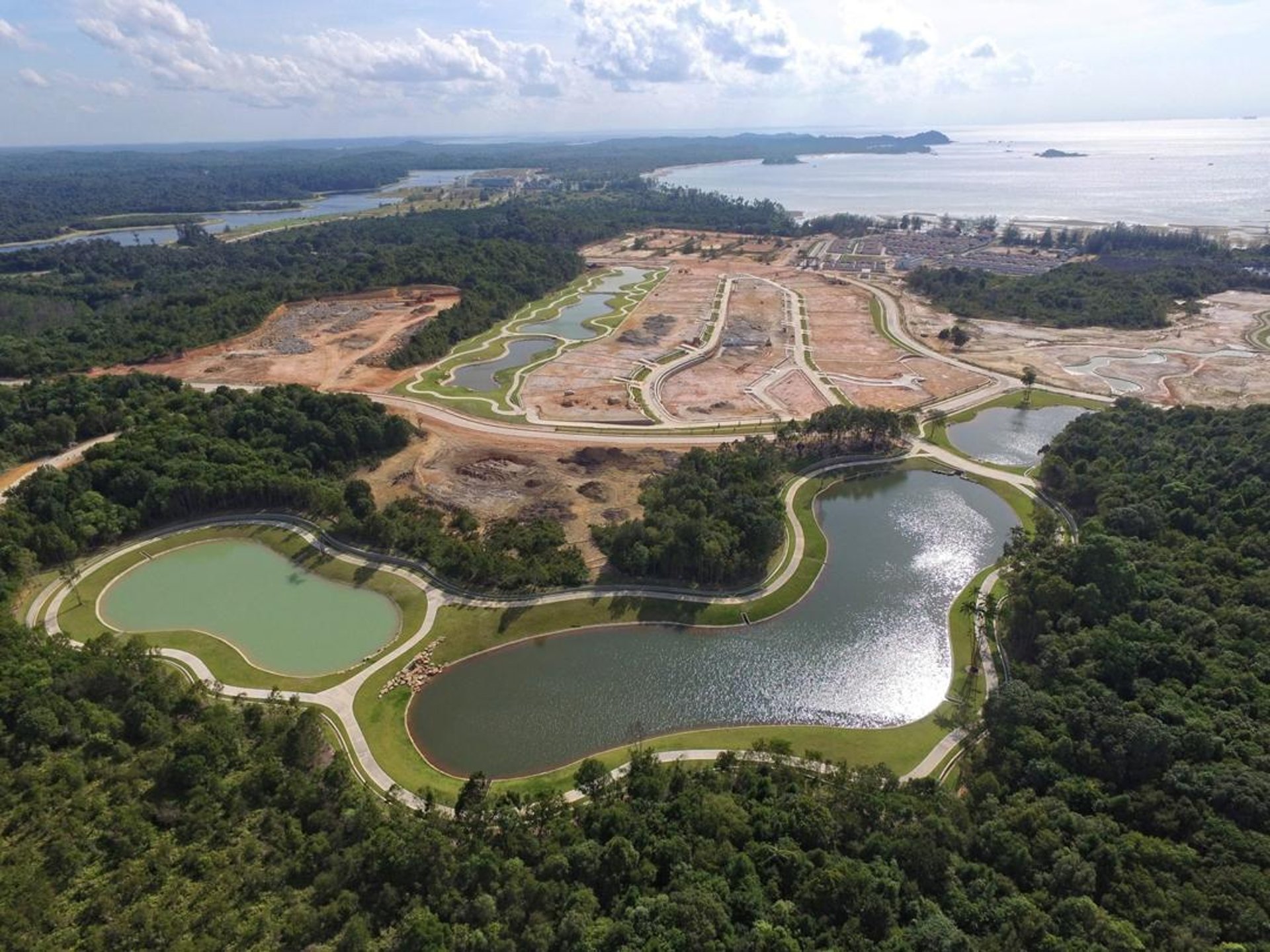 woman wearing yellow long-sleeved dress under white clouds and blue sky during daytime