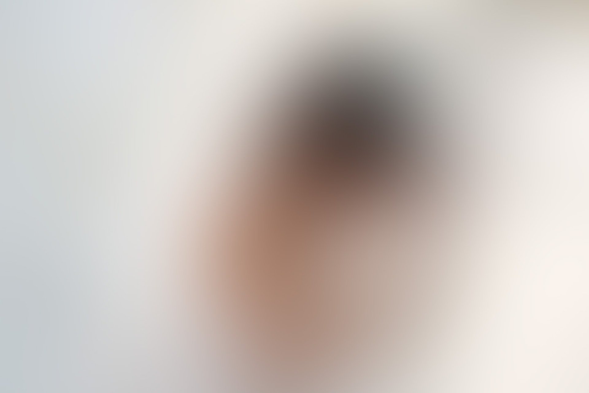 a close up of a black and brown abstract painting