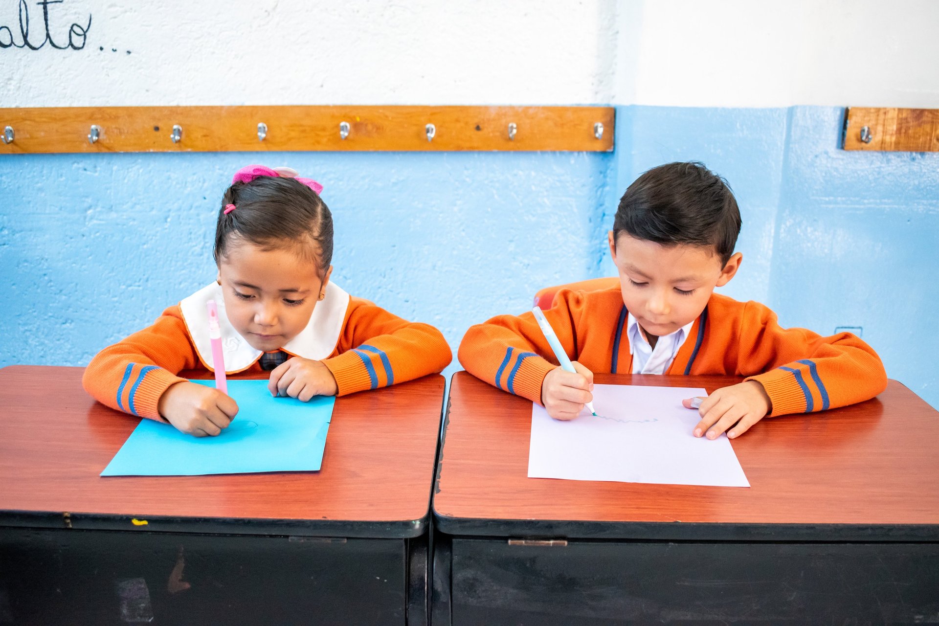 an abstract photo of a curved building with a blue sky in the background