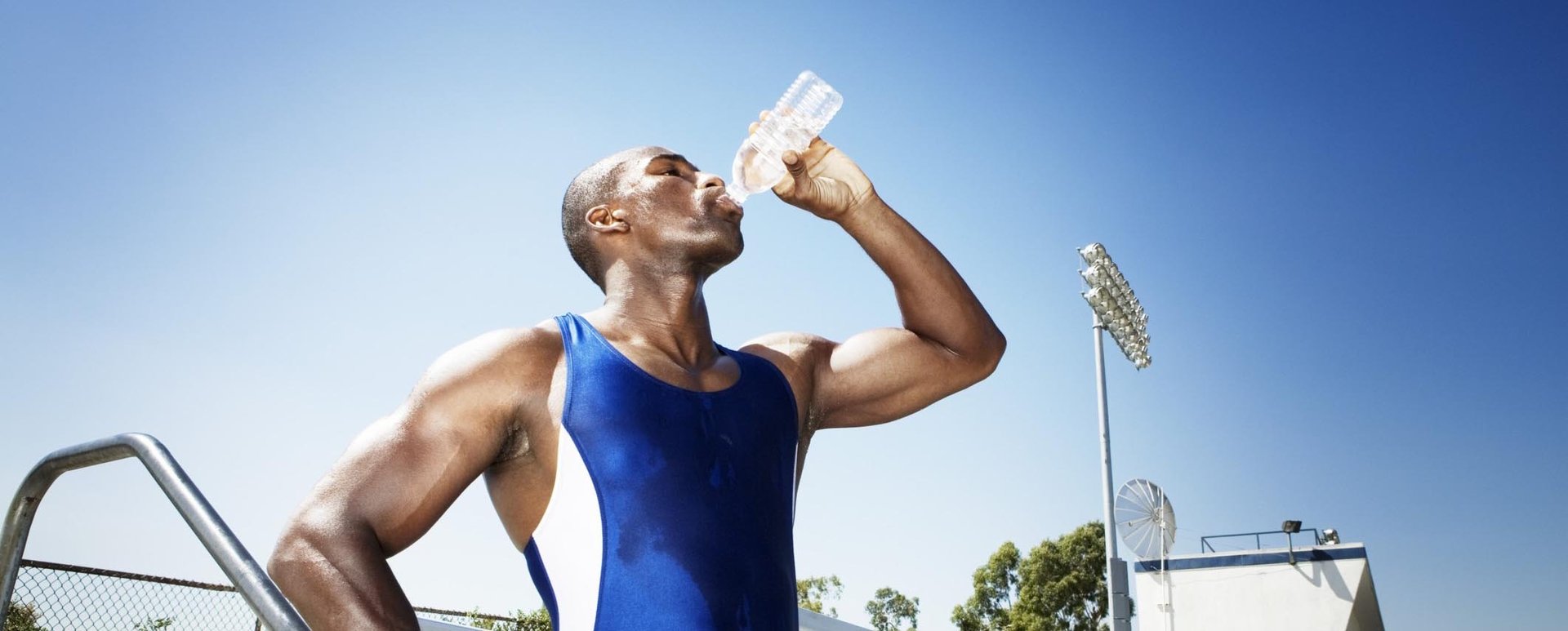 woman wearing yellow long-sleeved dress under white clouds and blue sky during daytime