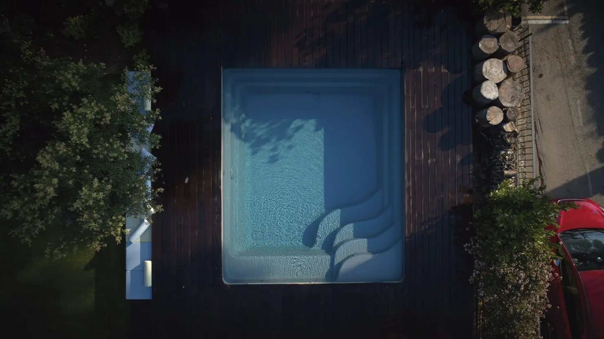 an abstract photo of a curved building with a blue sky in the background