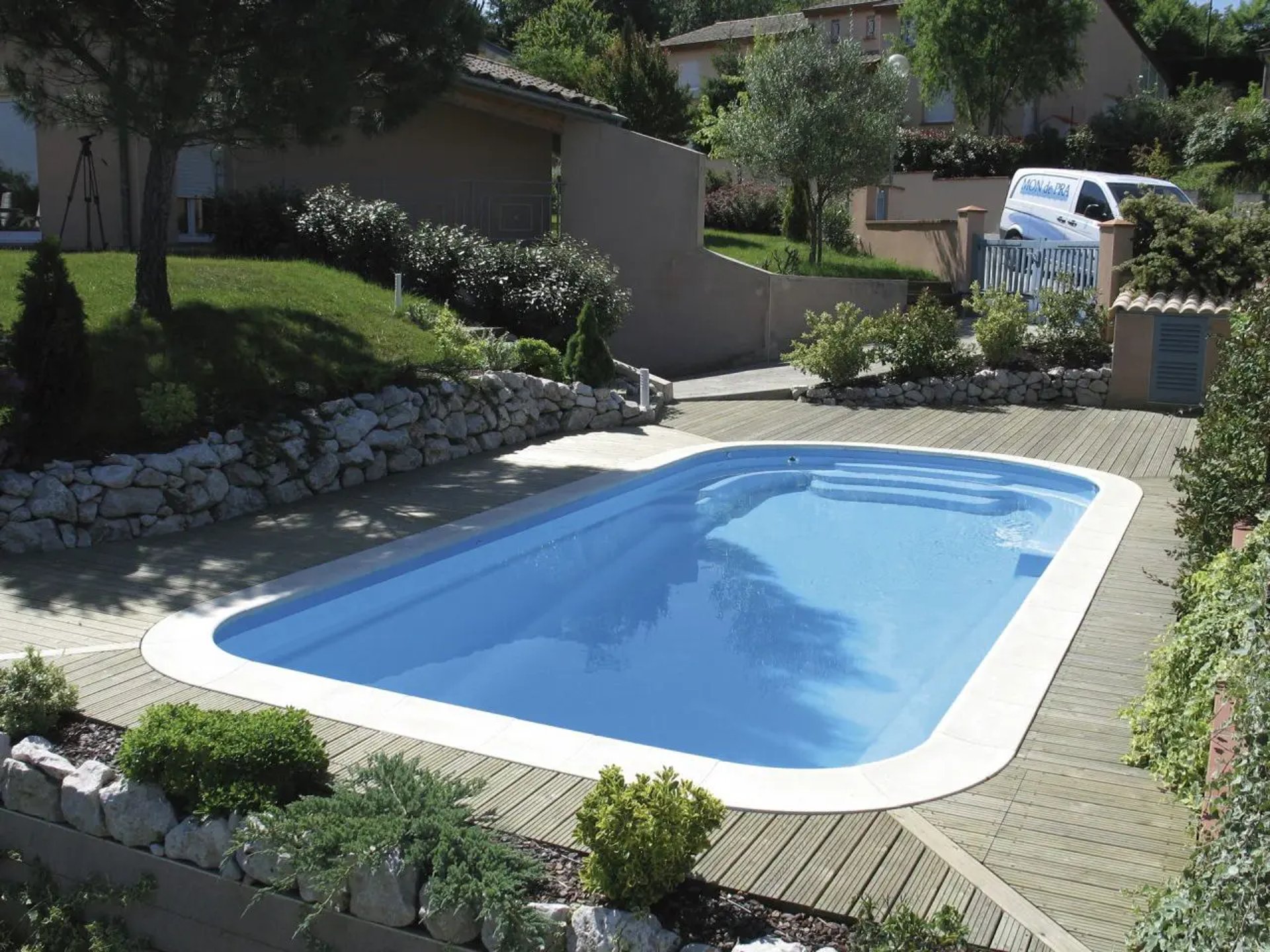 an abstract photo of a curved building with a blue sky in the background