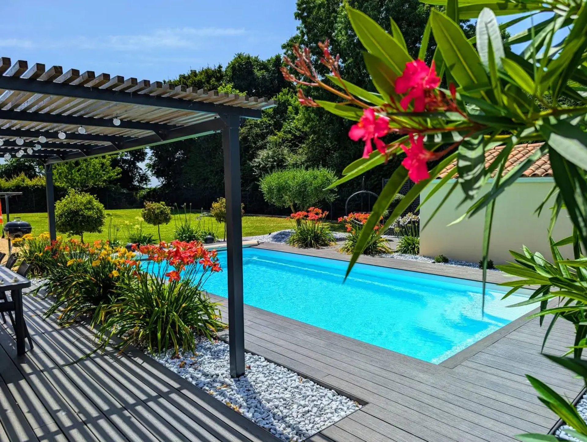 an abstract photo of a curved building with a blue sky in the background