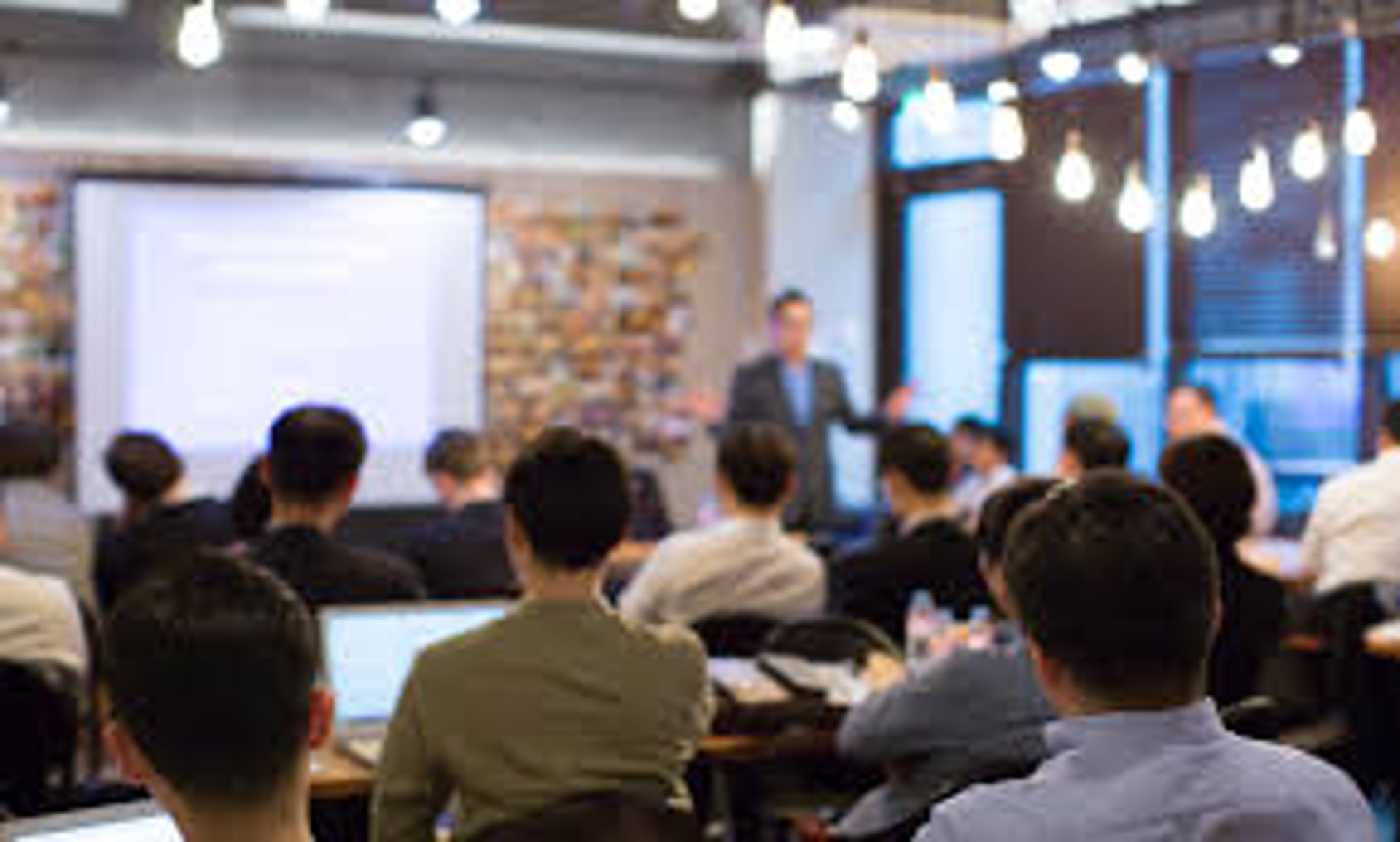 an abstract photo of a curved building with a blue sky in the background
