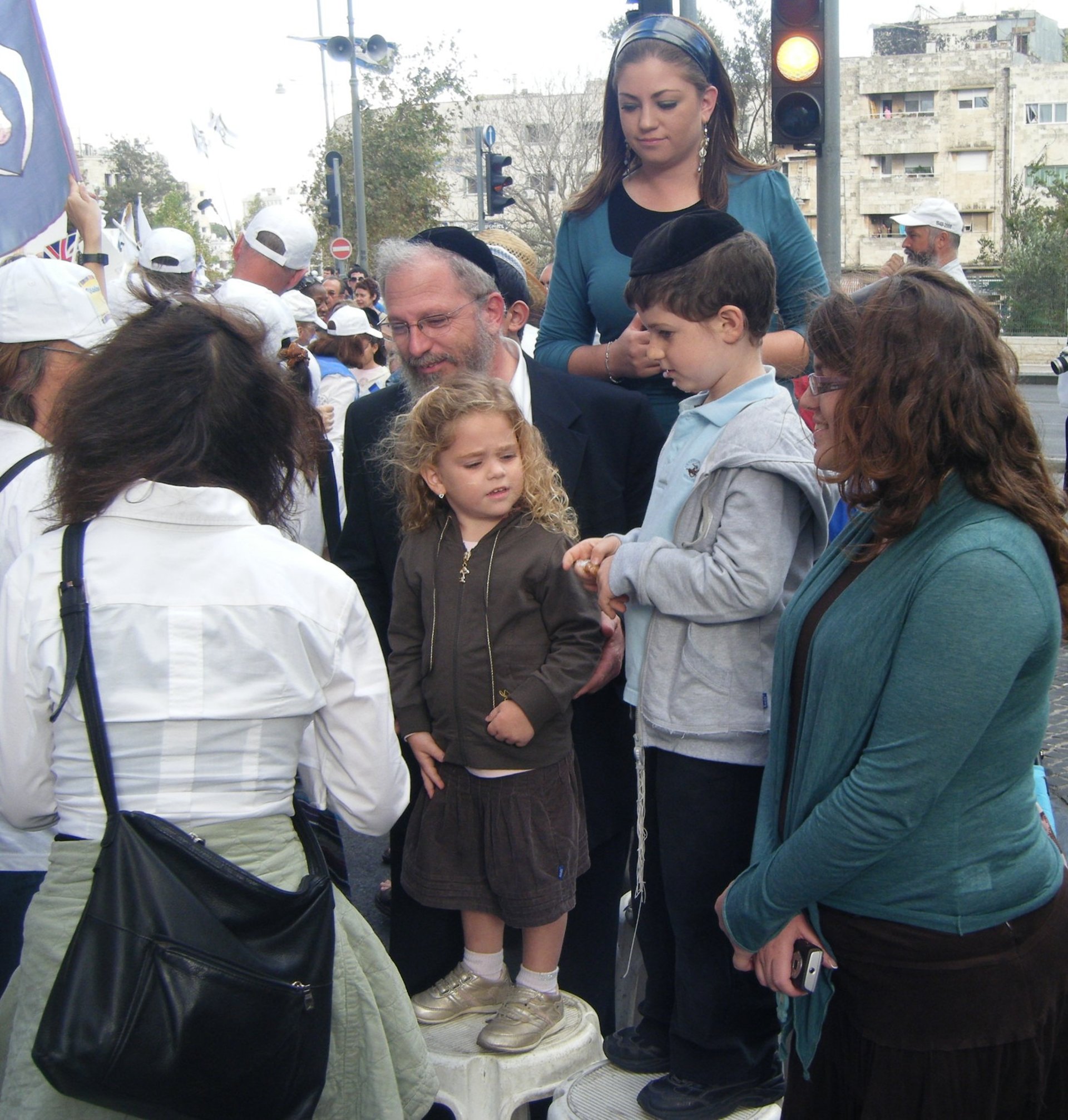 woman wearing yellow long-sleeved dress under white clouds and blue sky during daytime
