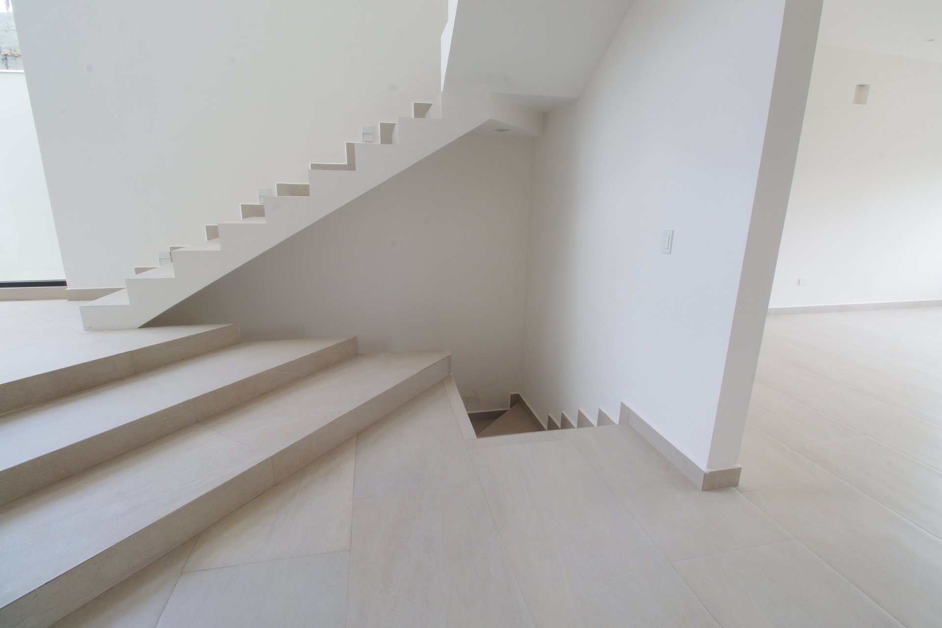 an abstract photo of a curved building with a blue sky in the background