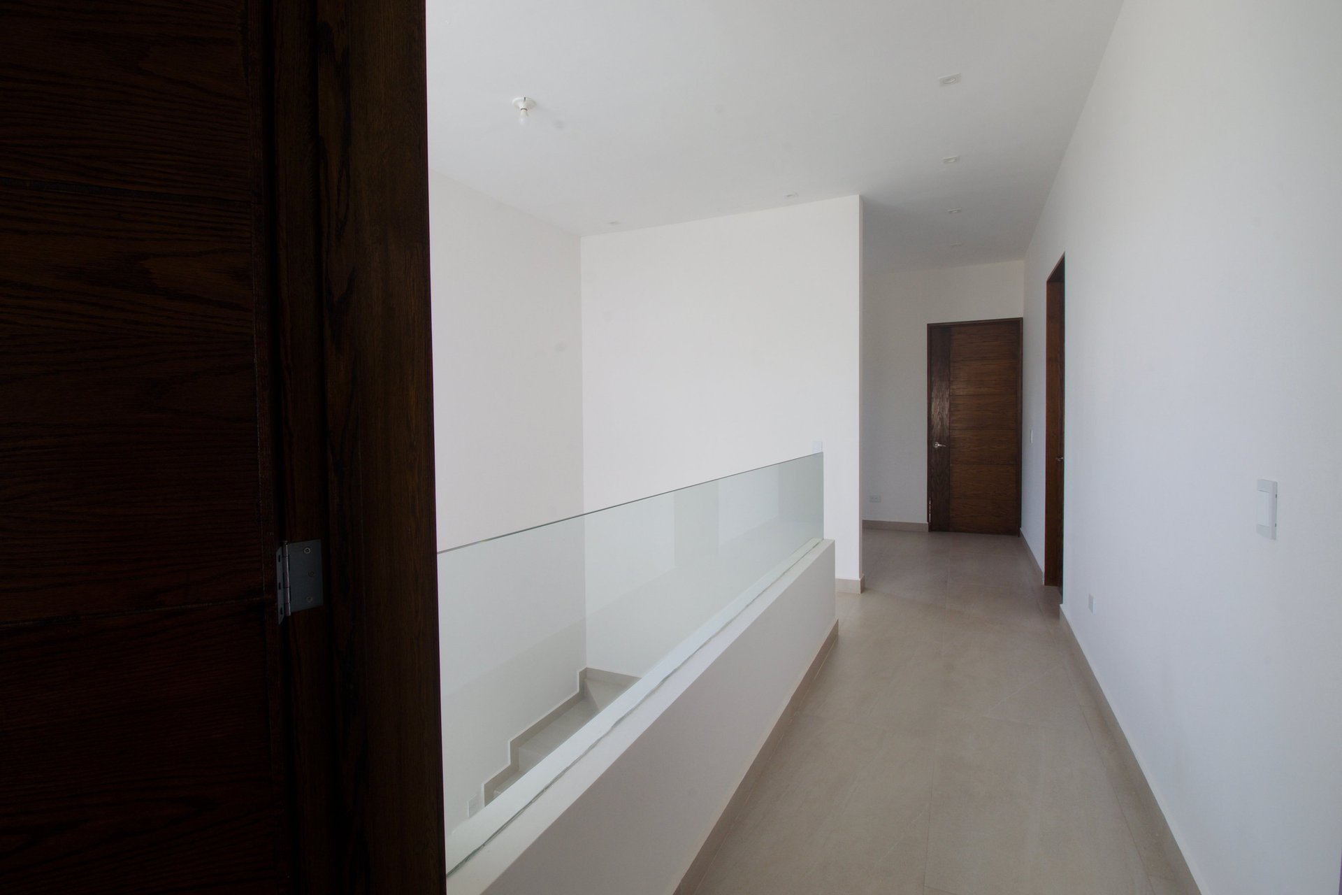 an abstract photo of a curved building with a blue sky in the background