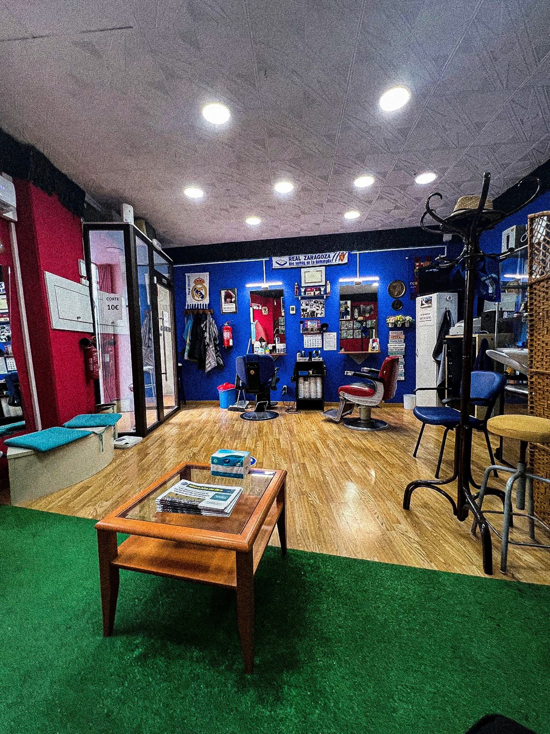 a person holding a pair of scissors in their hand