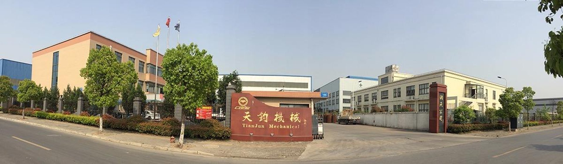 red and white train on rail tracks under blue sky and white clouds during daytime