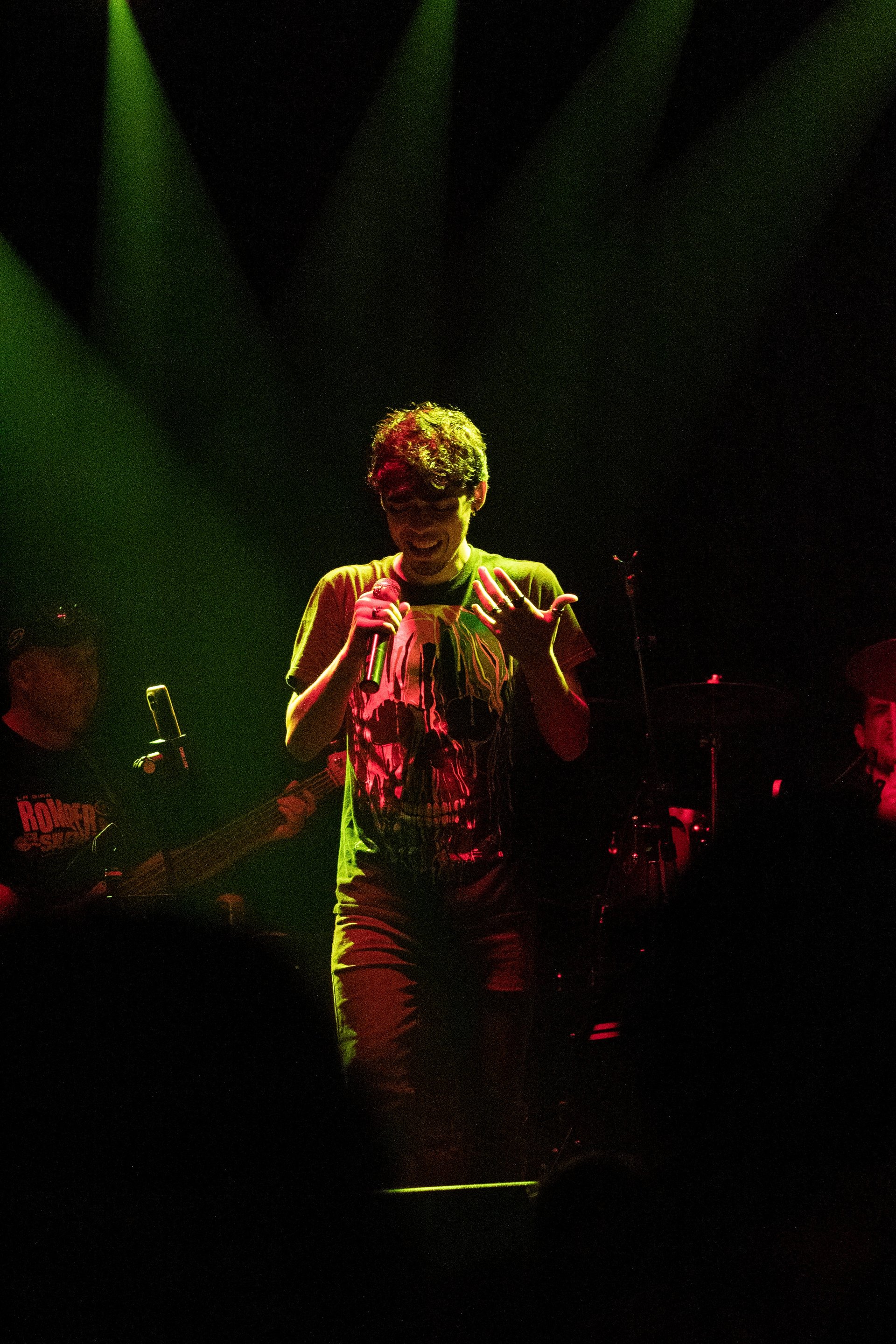 woman in white and brown dress standing on green grass during night time