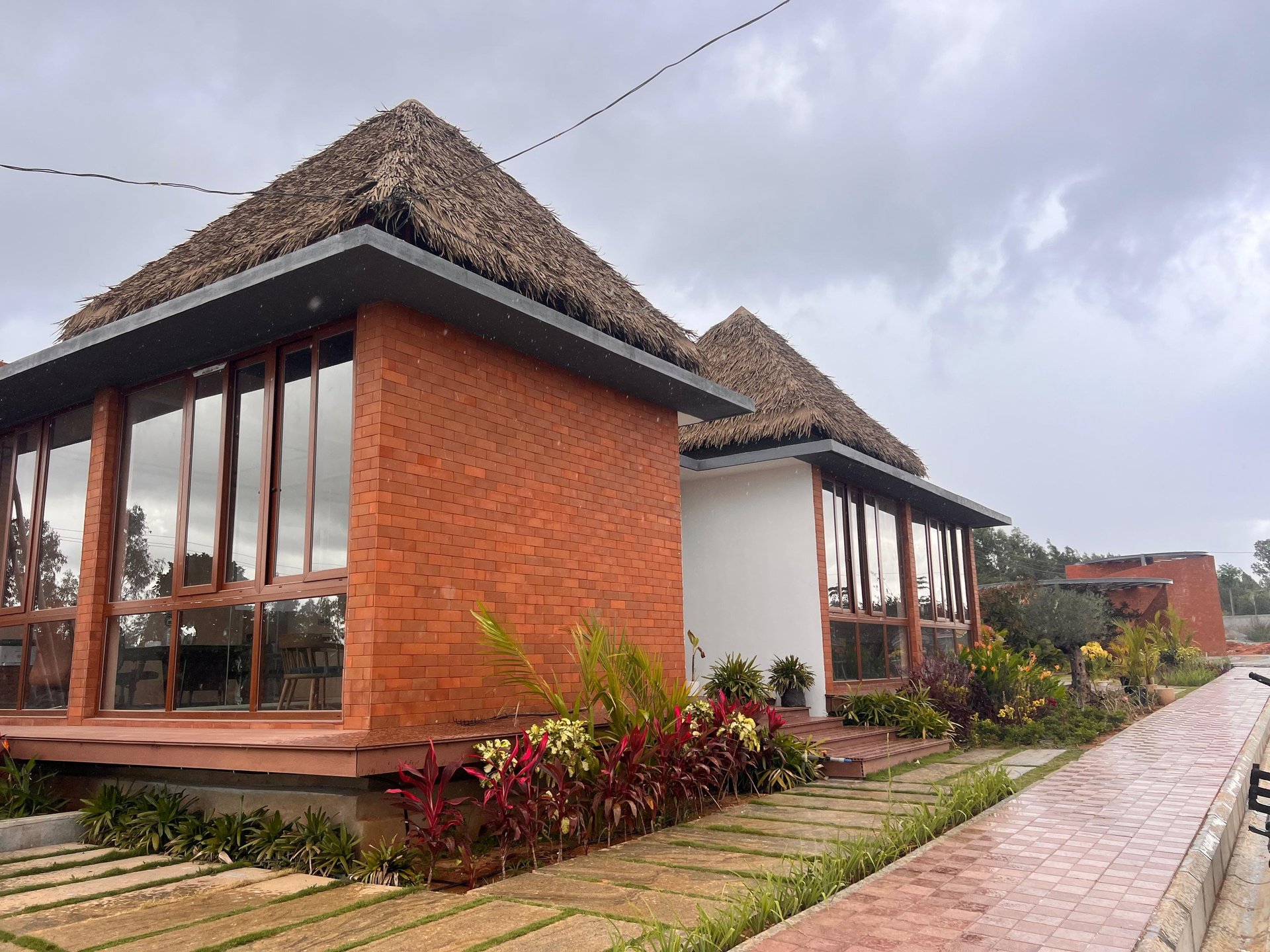 a tall brick building with a clock on it's side