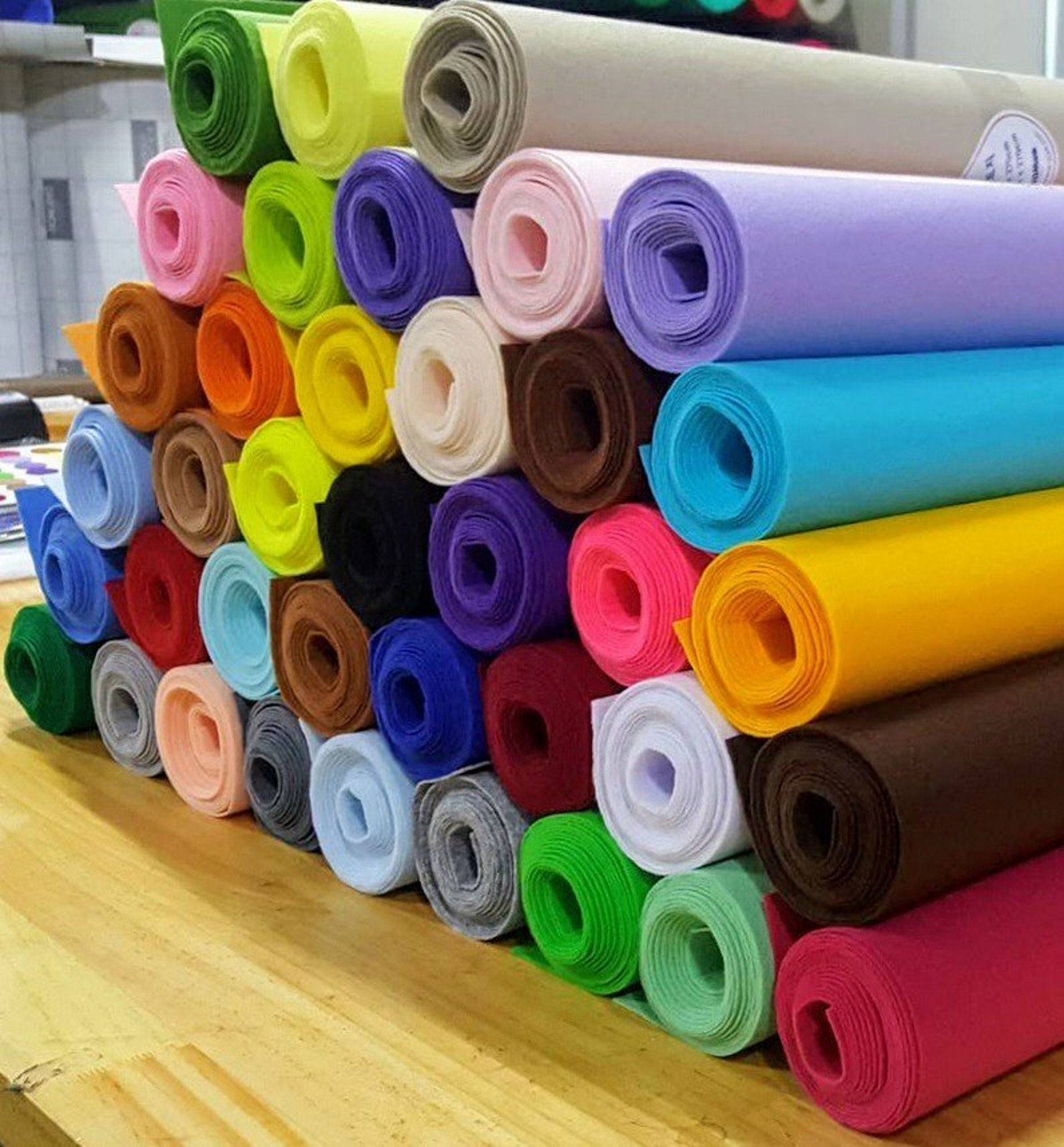 Two white and blue polo shirts on a white background