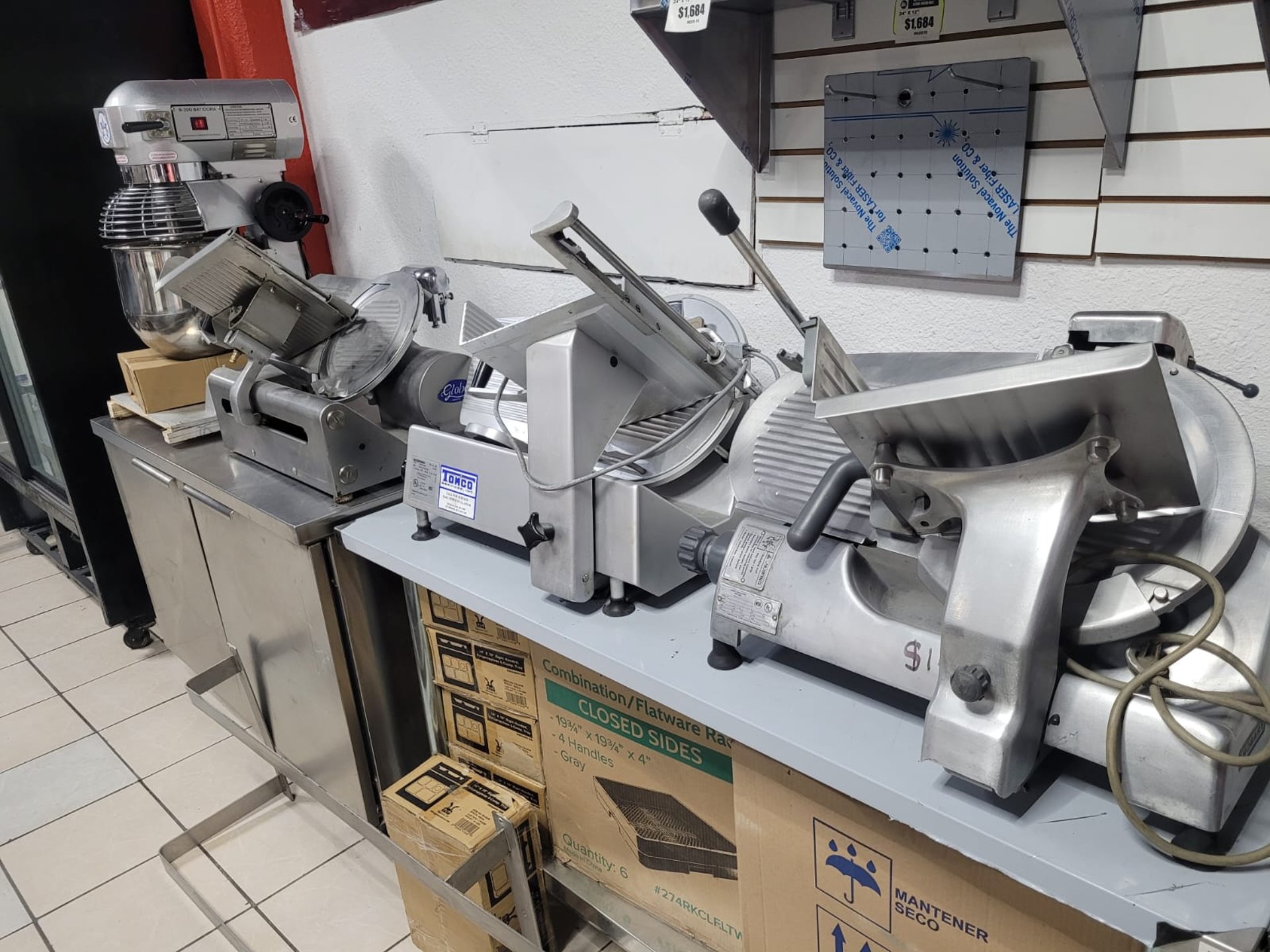 a kitchen with stainless steel appliances and a wooden counter